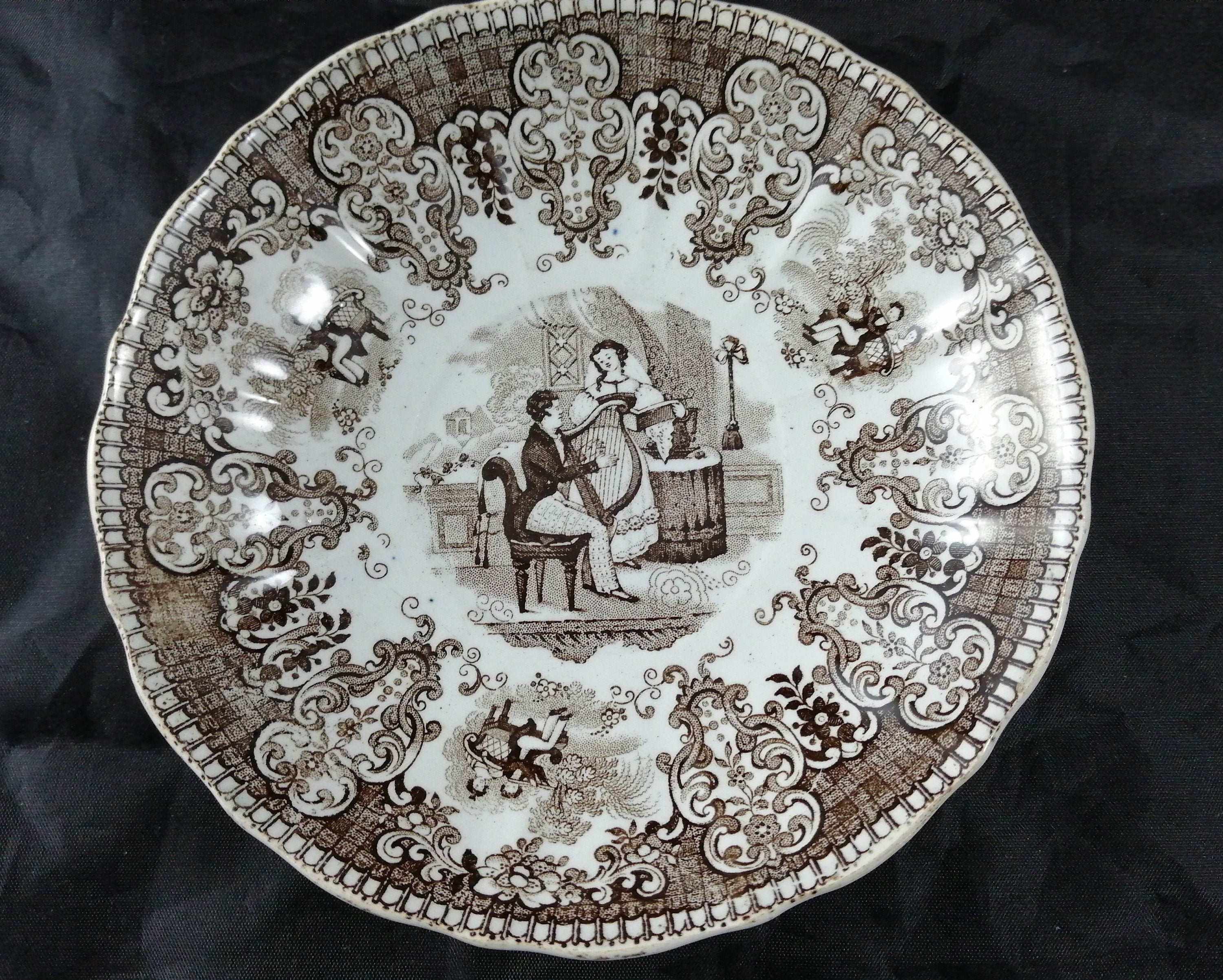 Empire Porcelain Teacup and Saucer, transfer-printer, Victorian motifs