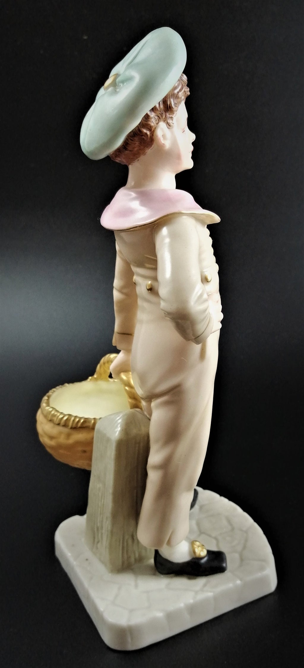 Antique Royal Worcester,boy with basket,modelled by James Hadley.