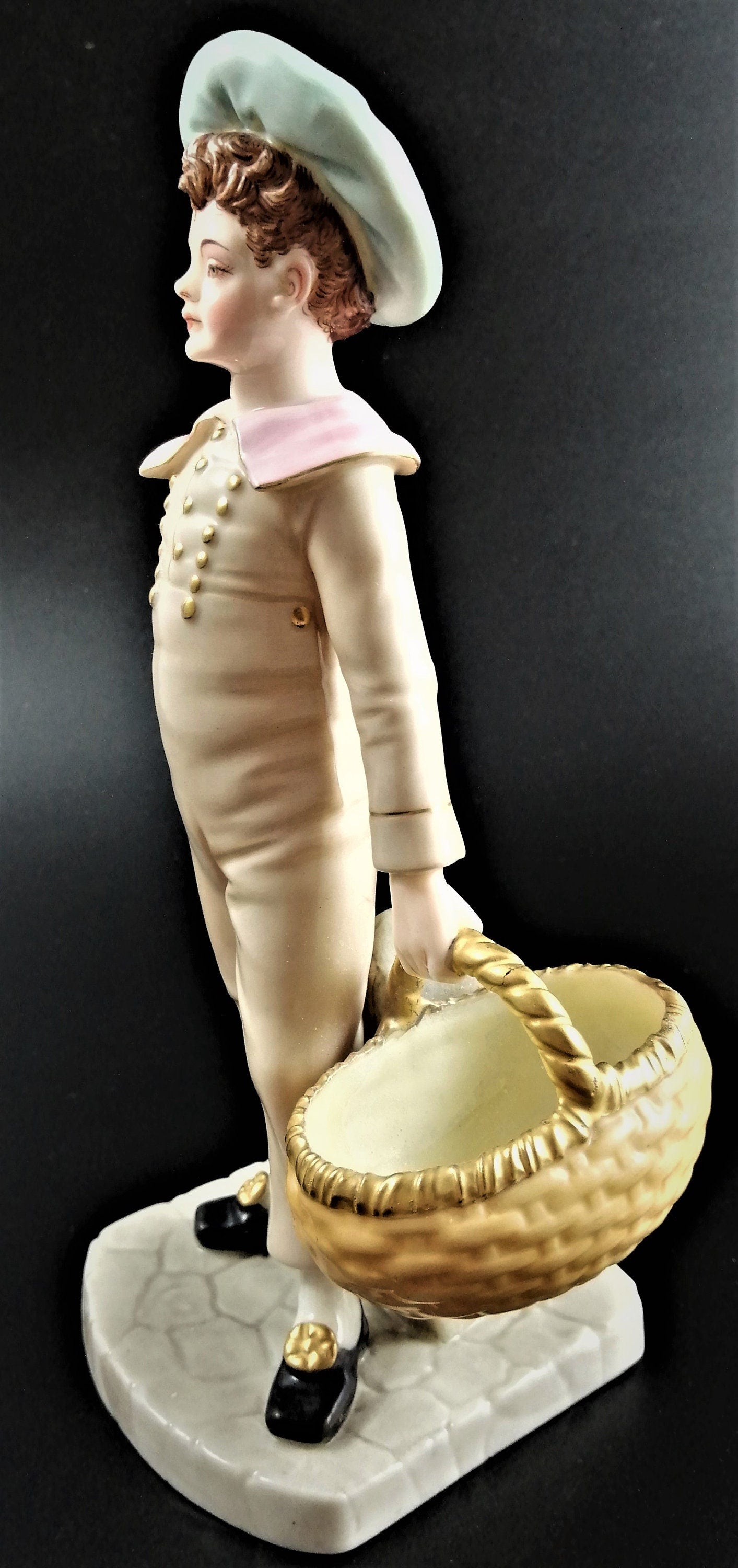 Antique Royal Worcester,boy with basket,modelled by James Hadley.