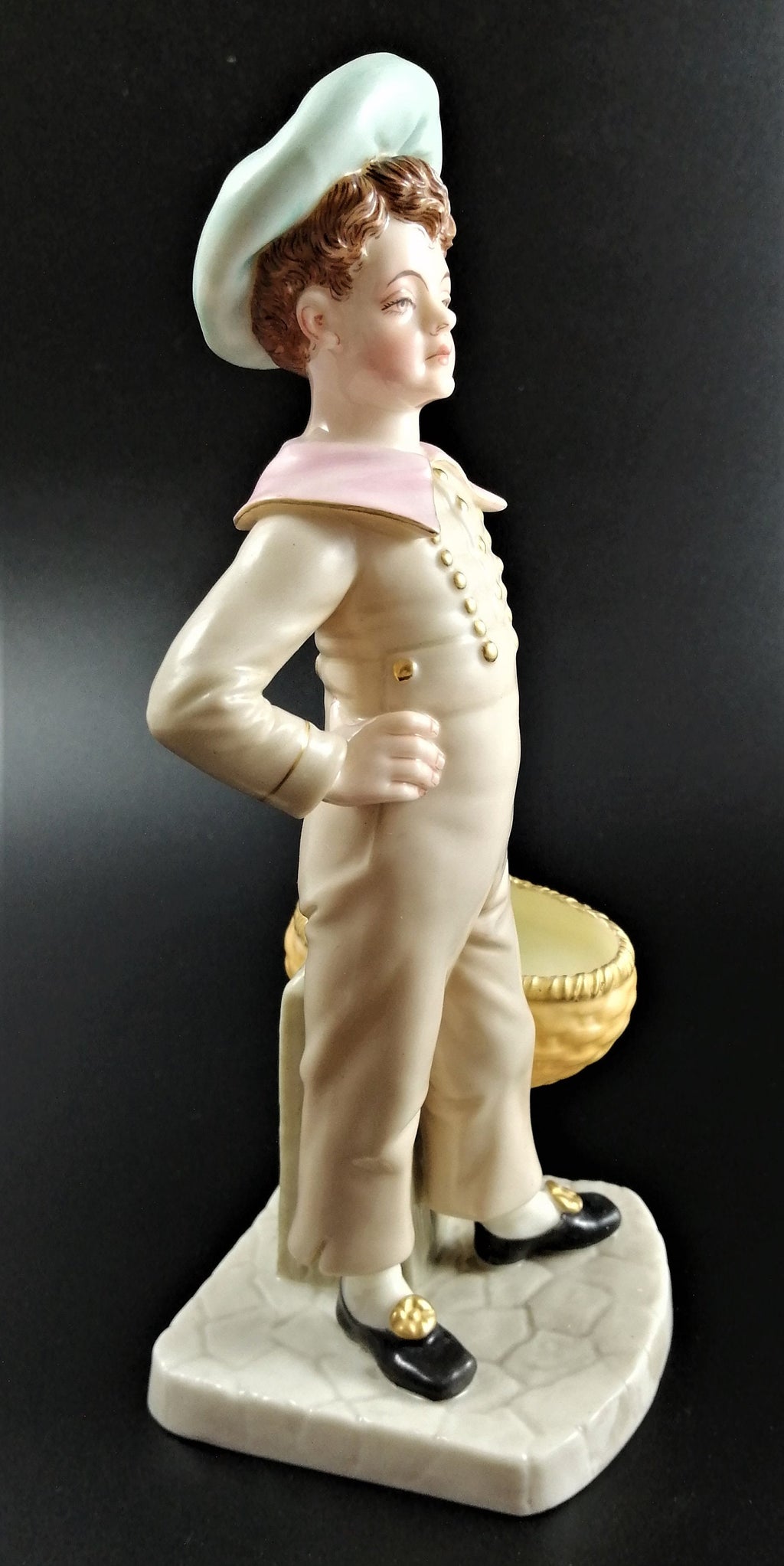 Antique Royal Worcester,boy with basket,modelled by James Hadley.