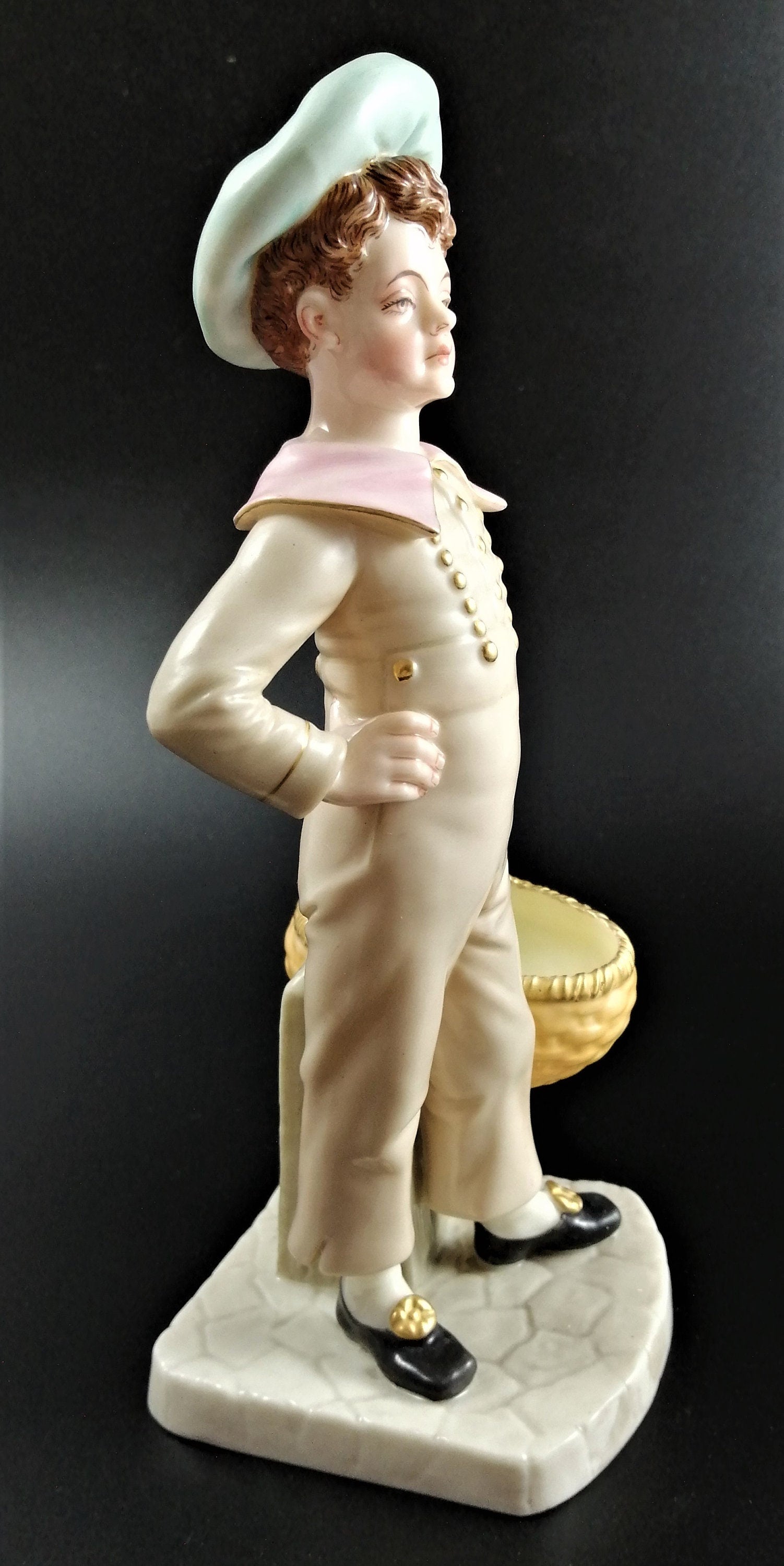 Antique Royal Worcester,boy with basket,modelled by James Hadley.