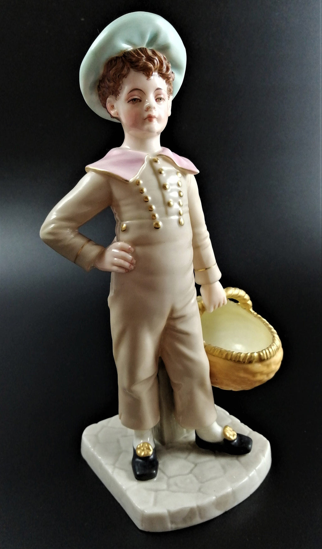 Antique Royal Worcester,boy with basket,modelled by James Hadley.