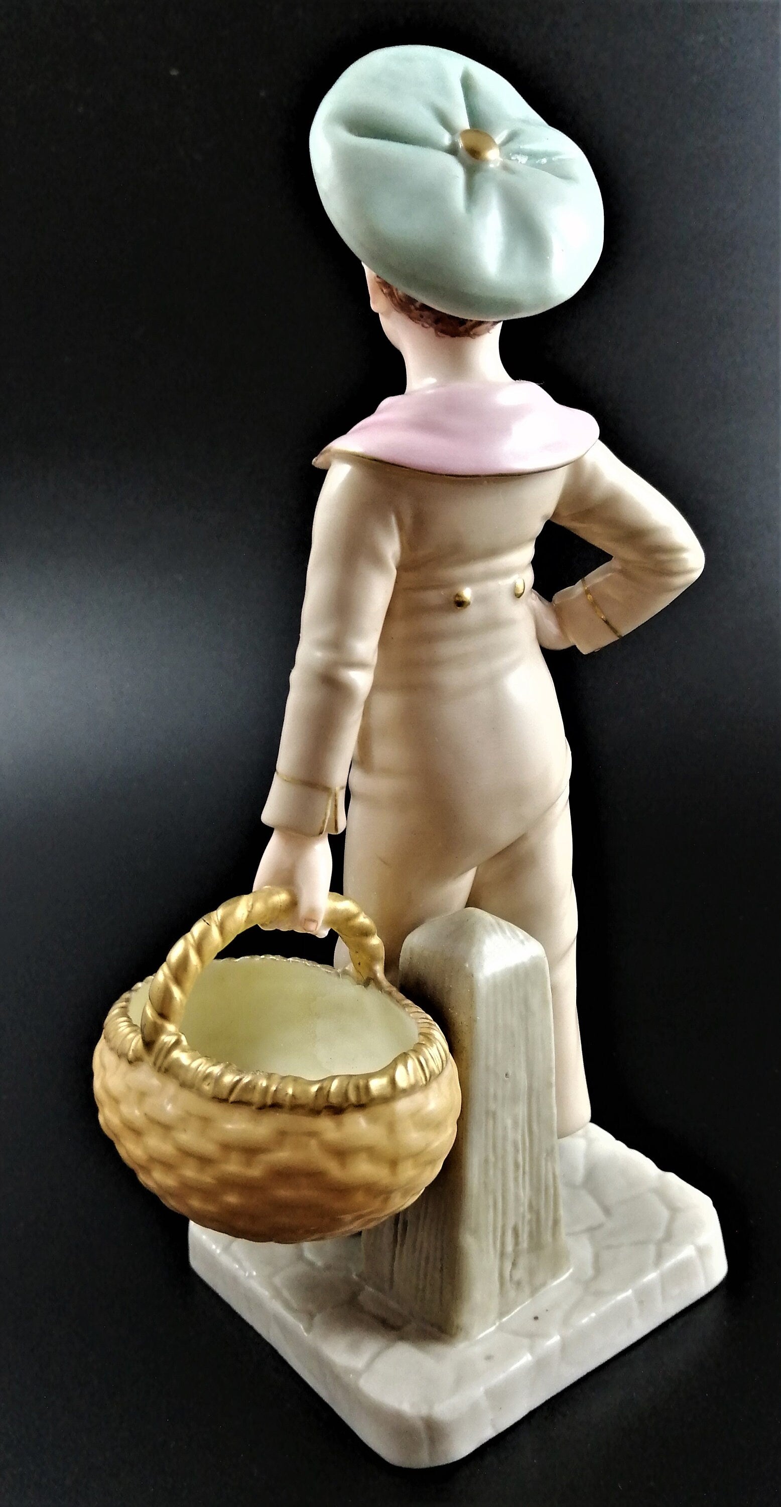 Antique Royal Worcester,boy with basket,modelled by James Hadley.