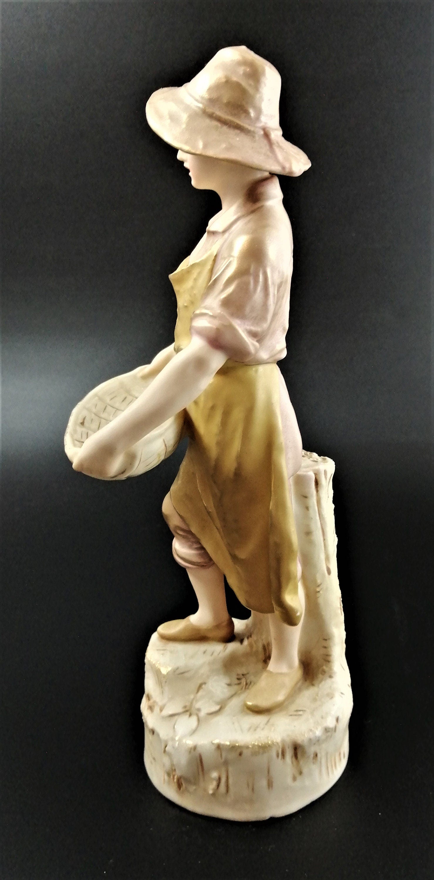 Antique Royal Dux Porcelain Figurine of young man carrying gathering baskets
