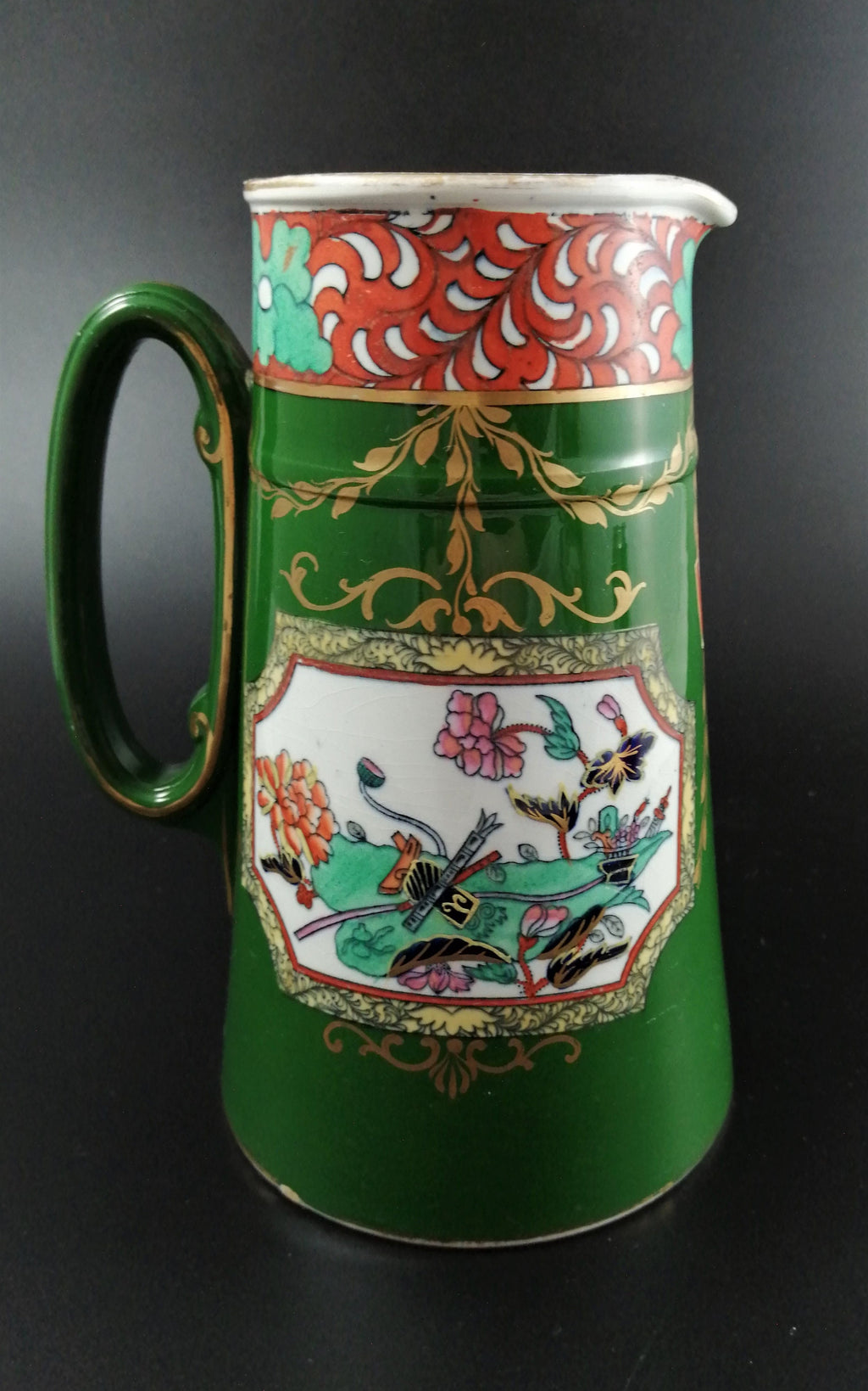 Rare antique Ashworth's Ironstone jug in the "Trophies" pattern