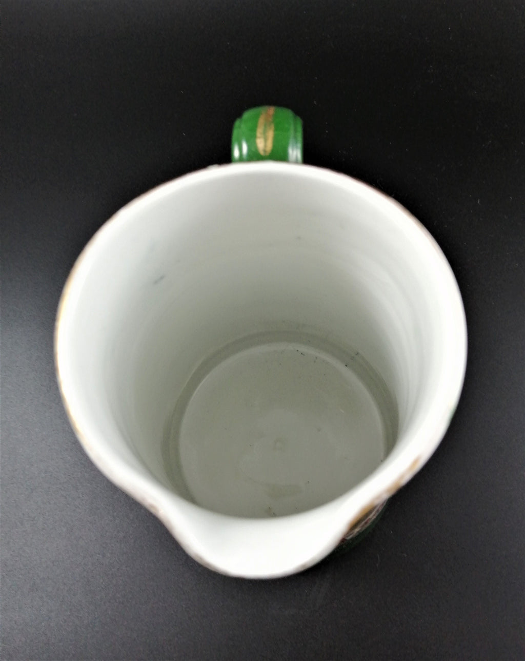 Rare antique Ashworth's Ironstone jug in the "Trophies" pattern