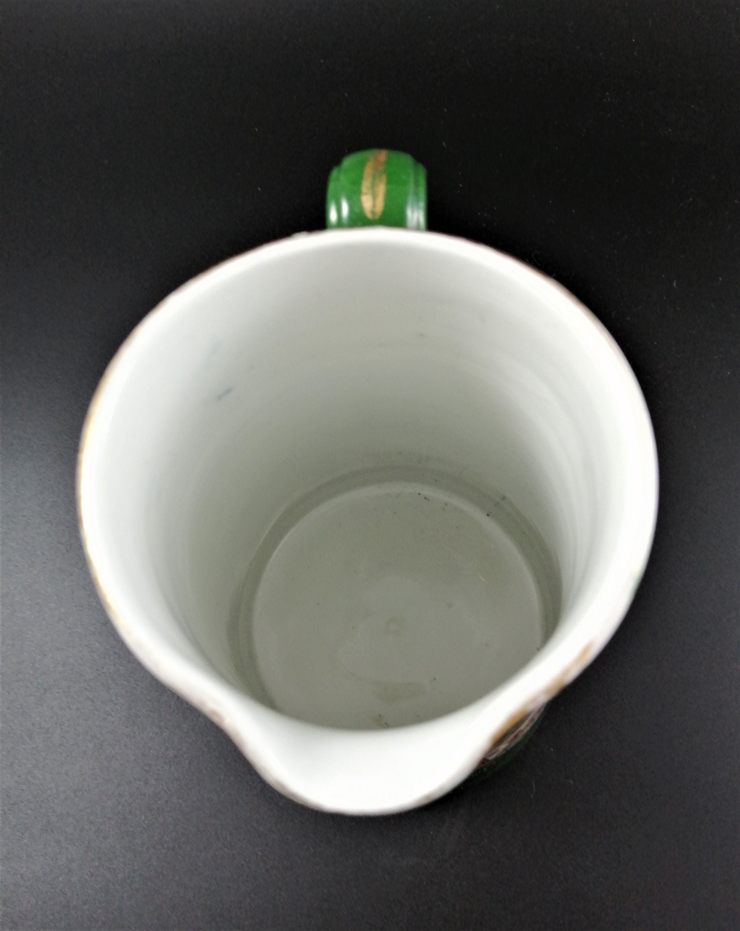 Rare antique Ashworth's Ironstone jug in the "Trophies" pattern