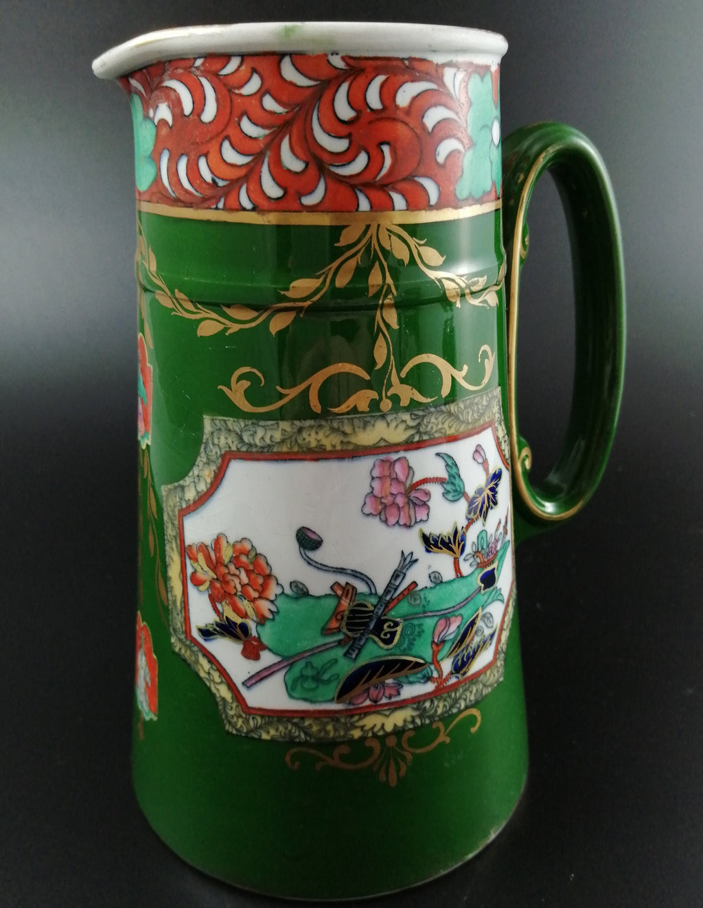 Rare antique Ashworth's Ironstone jug in the "Trophies" pattern