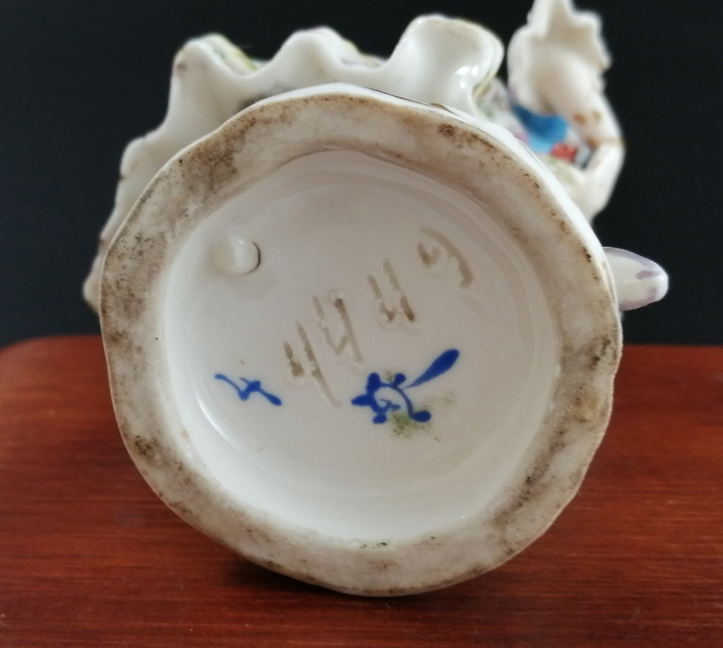 Antique Bavarian porcelain figurine of lady with flowers, Lenck Family, 1840’s