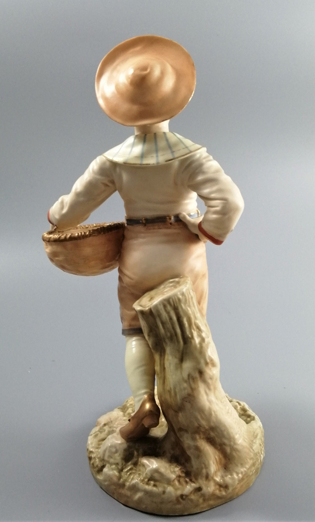 Antique Royal Worcester,boy with basket,modelled by James Hadley.