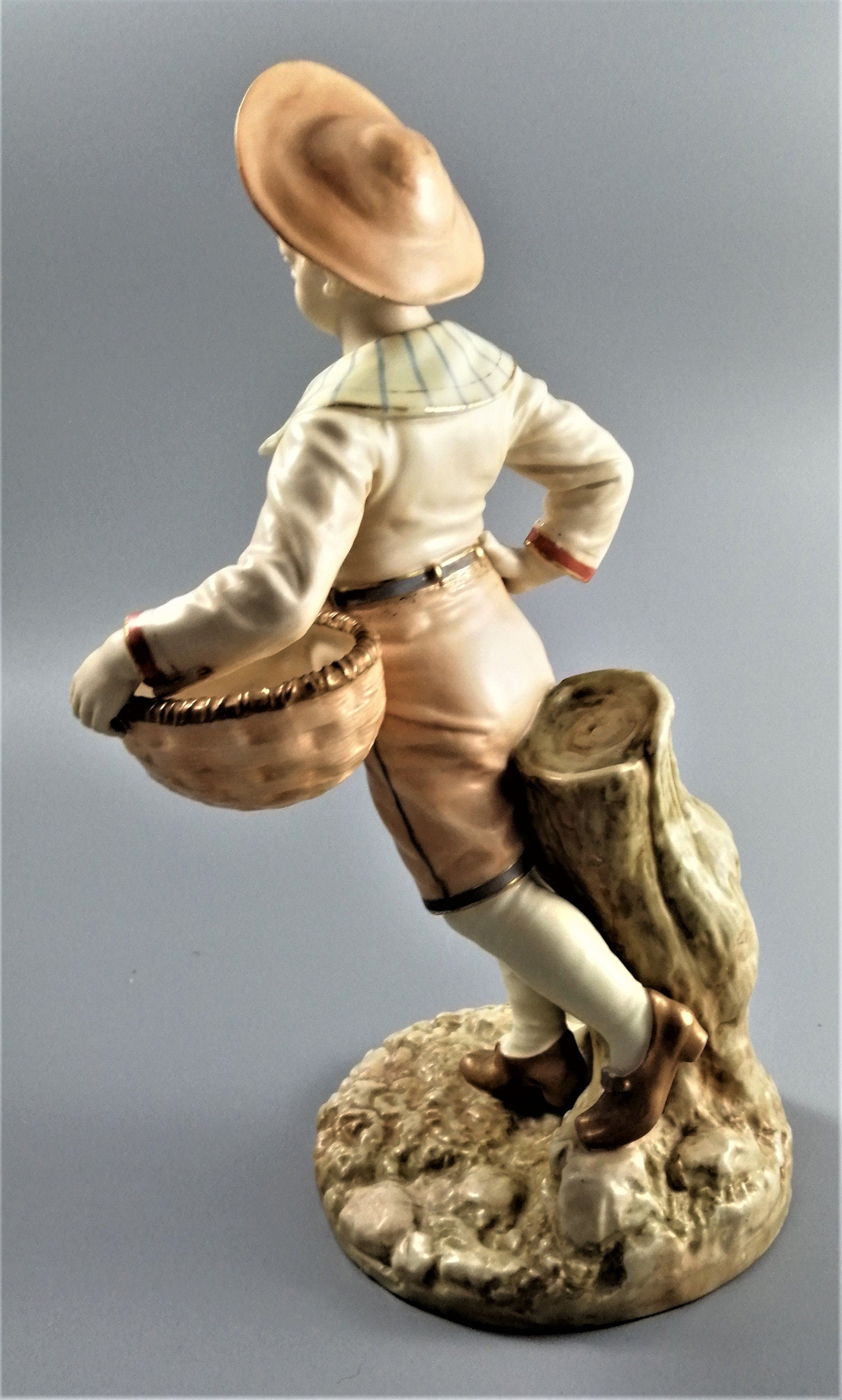 Antique Royal Worcester,boy with basket,modelled by James Hadley.