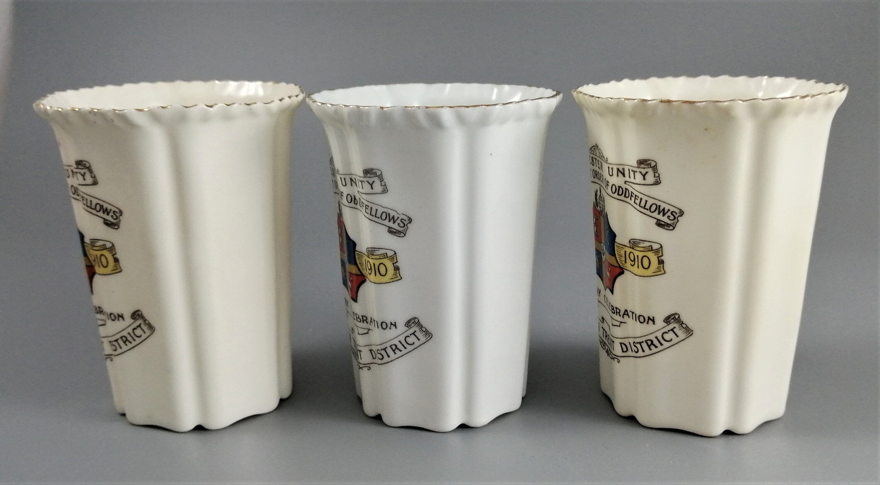 Three antique porcelain beakers, Manchester Unity of the Independent Order of Oddfellows.