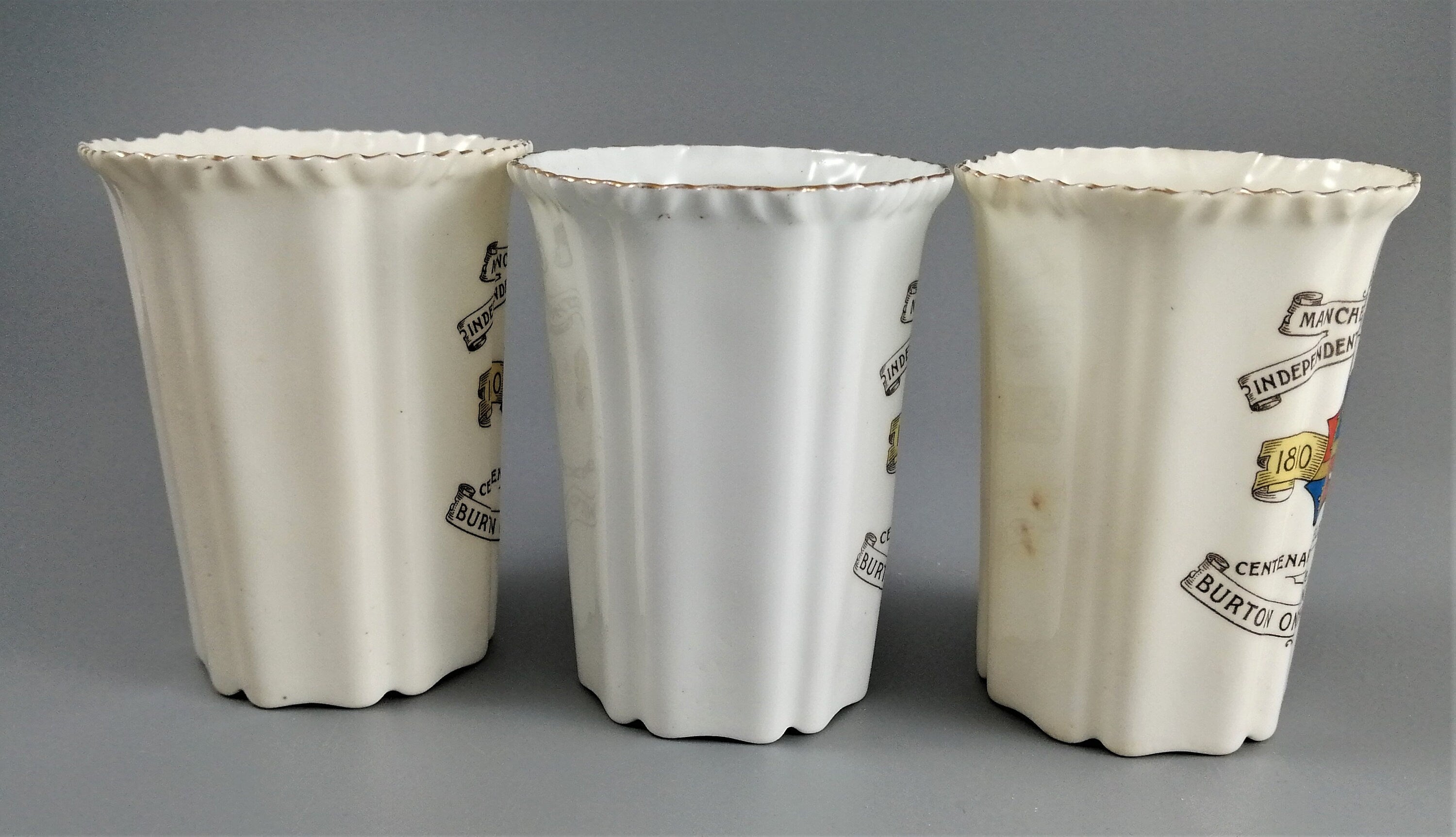 Three antique porcelain beakers, Manchester Unity of the Independent Order of Oddfellows.