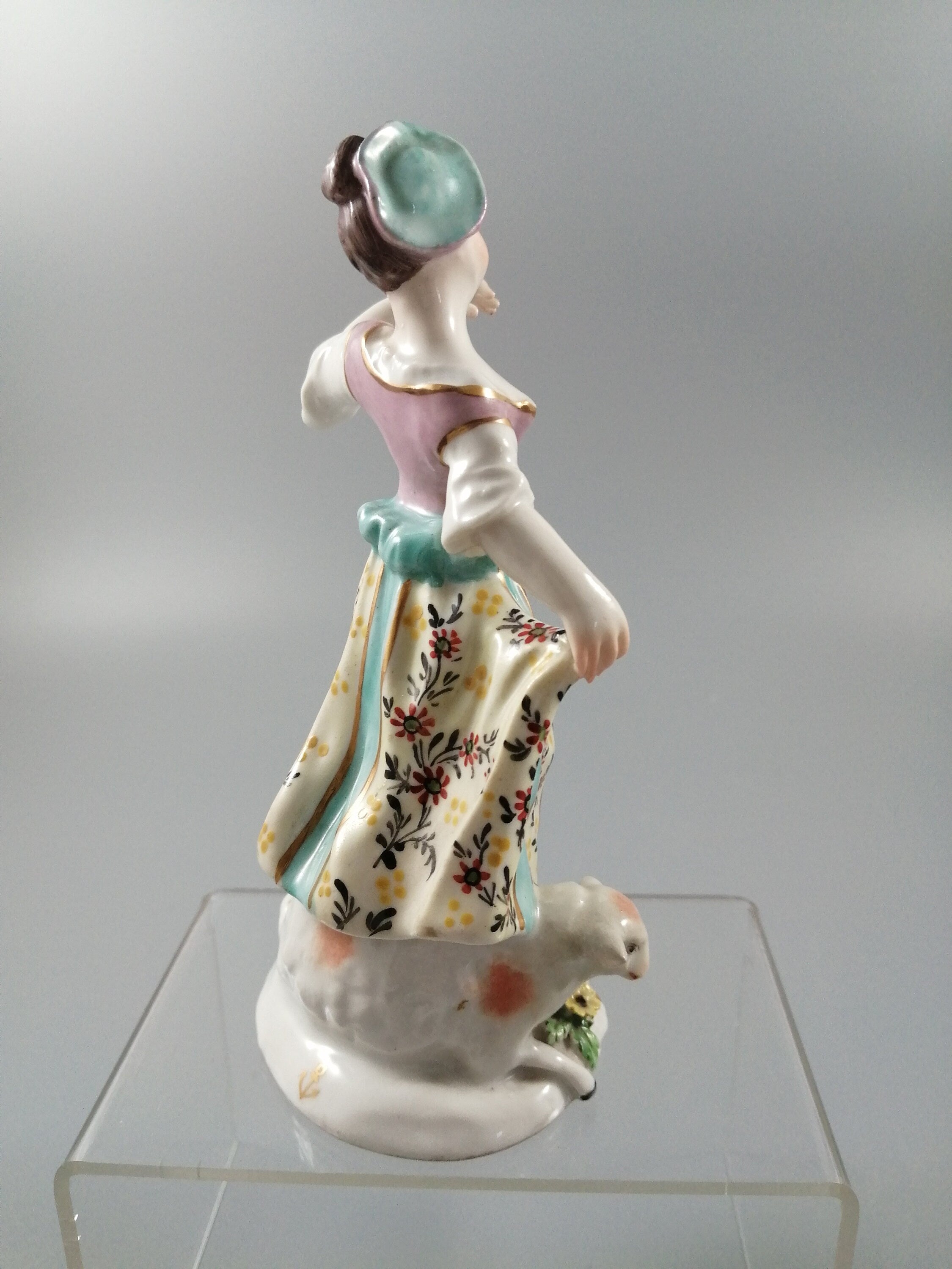 Possibly Chelsea porcelain figurine of young woman shepherdess, gold anchor mark, c. 1820