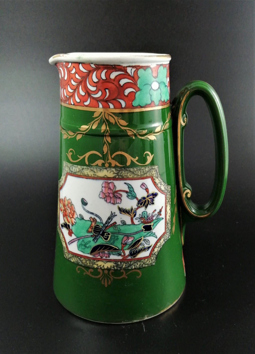 Rare antique Ashworth's Ironstone jug in the "Trophies" pattern