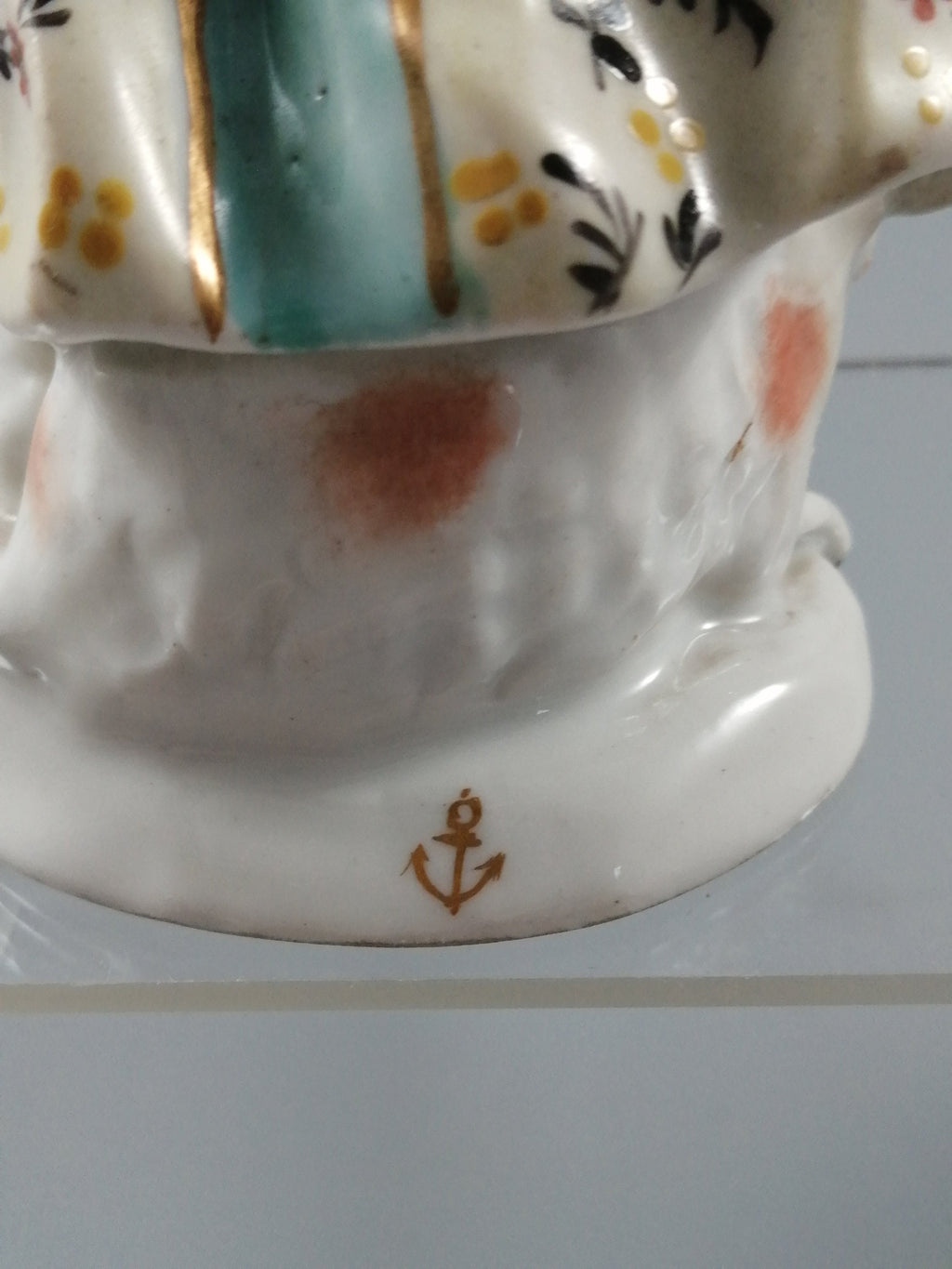 Possibly Chelsea porcelain figurine of young woman shepherdess, gold anchor mark, c. 1820