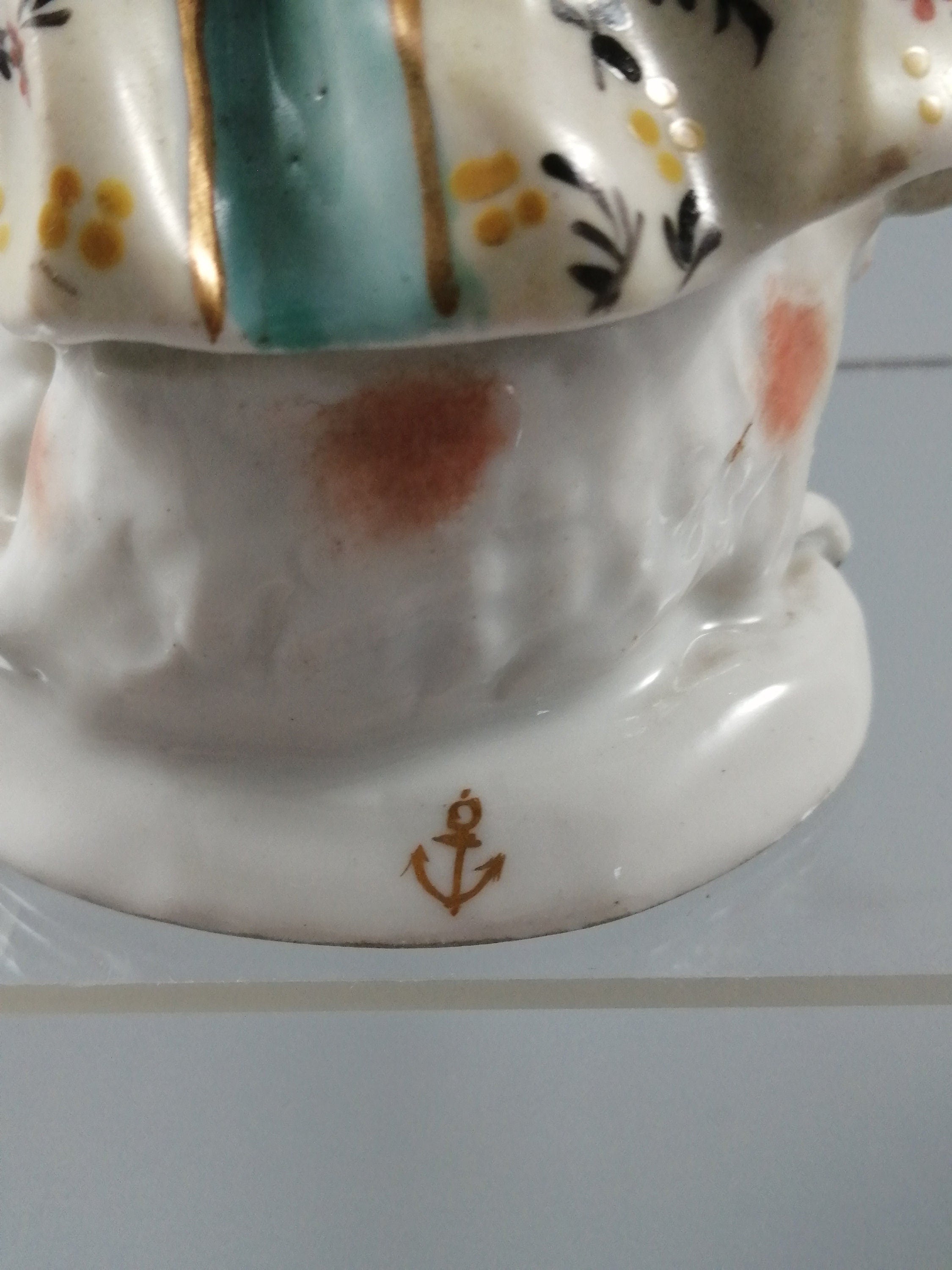 Possibly Chelsea porcelain figurine of young woman shepherdess, gold anchor mark, c. 1820