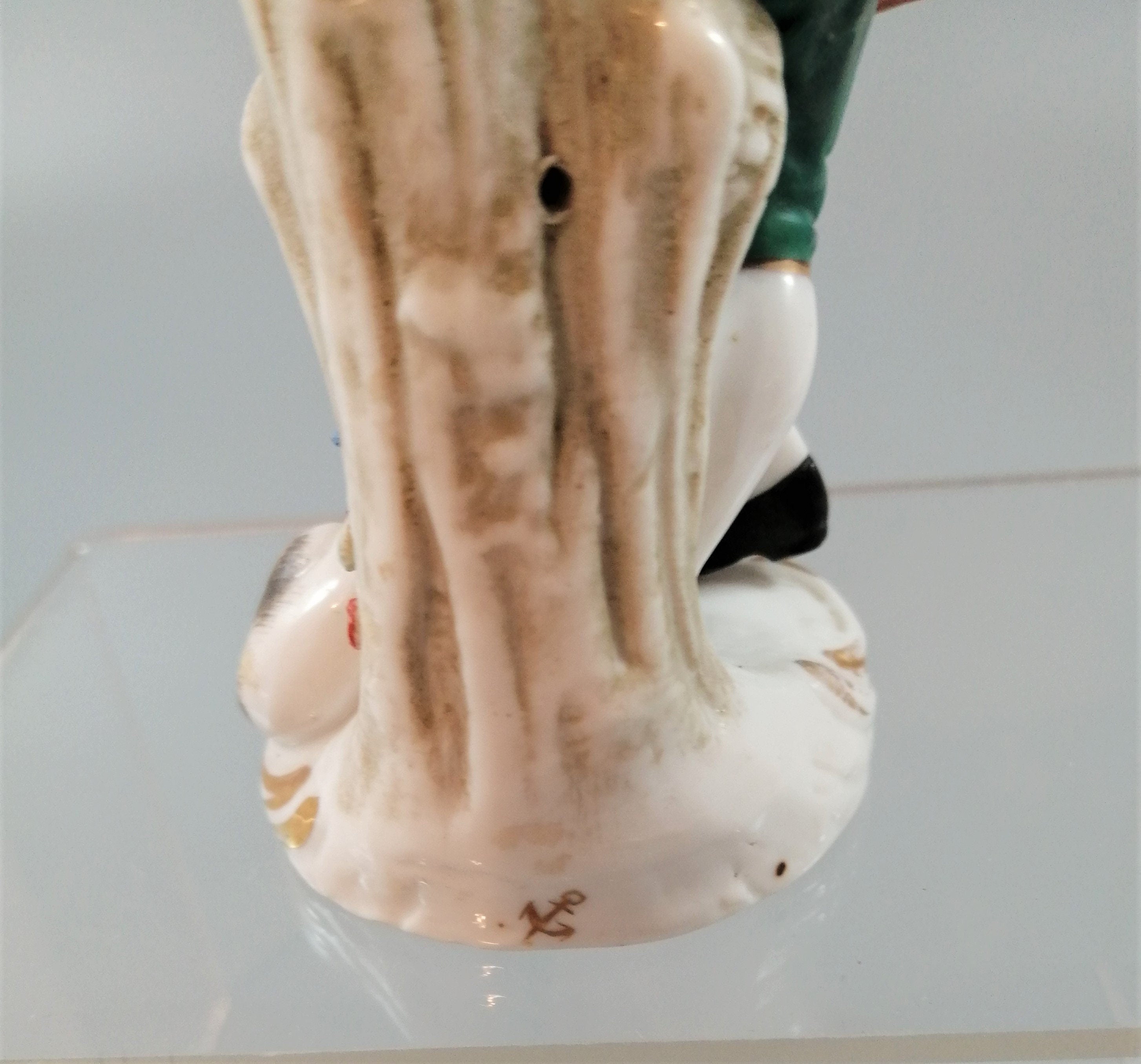Antique French Porcelain Figurine: Flute Player with Cat, Early 19th Century