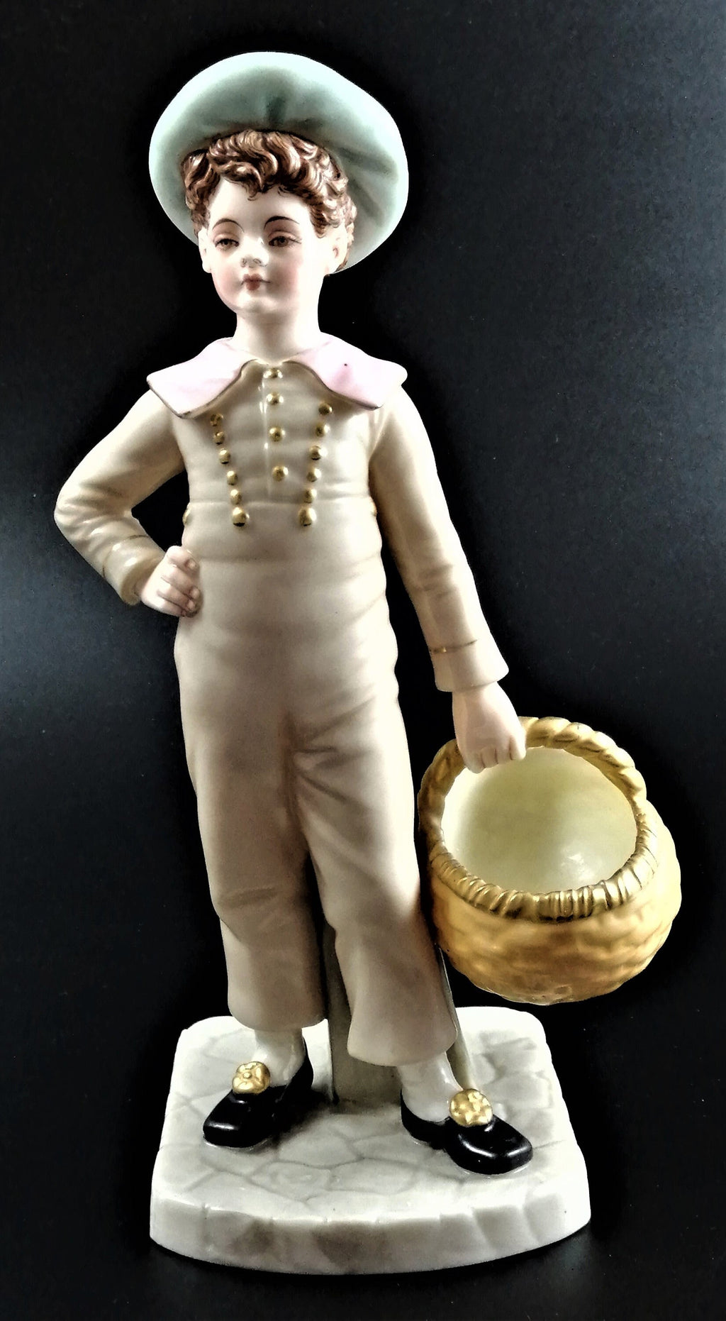 Antique Royal Worcester,boy with basket,modelled by James Hadley.