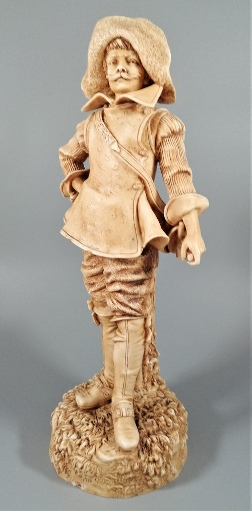 A Robinson and Leadbeater ivory parian ware figure of a musketeer