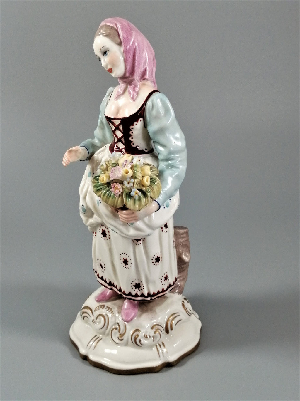 Antique porcelain figurine marked with the crossed swords of Meissen