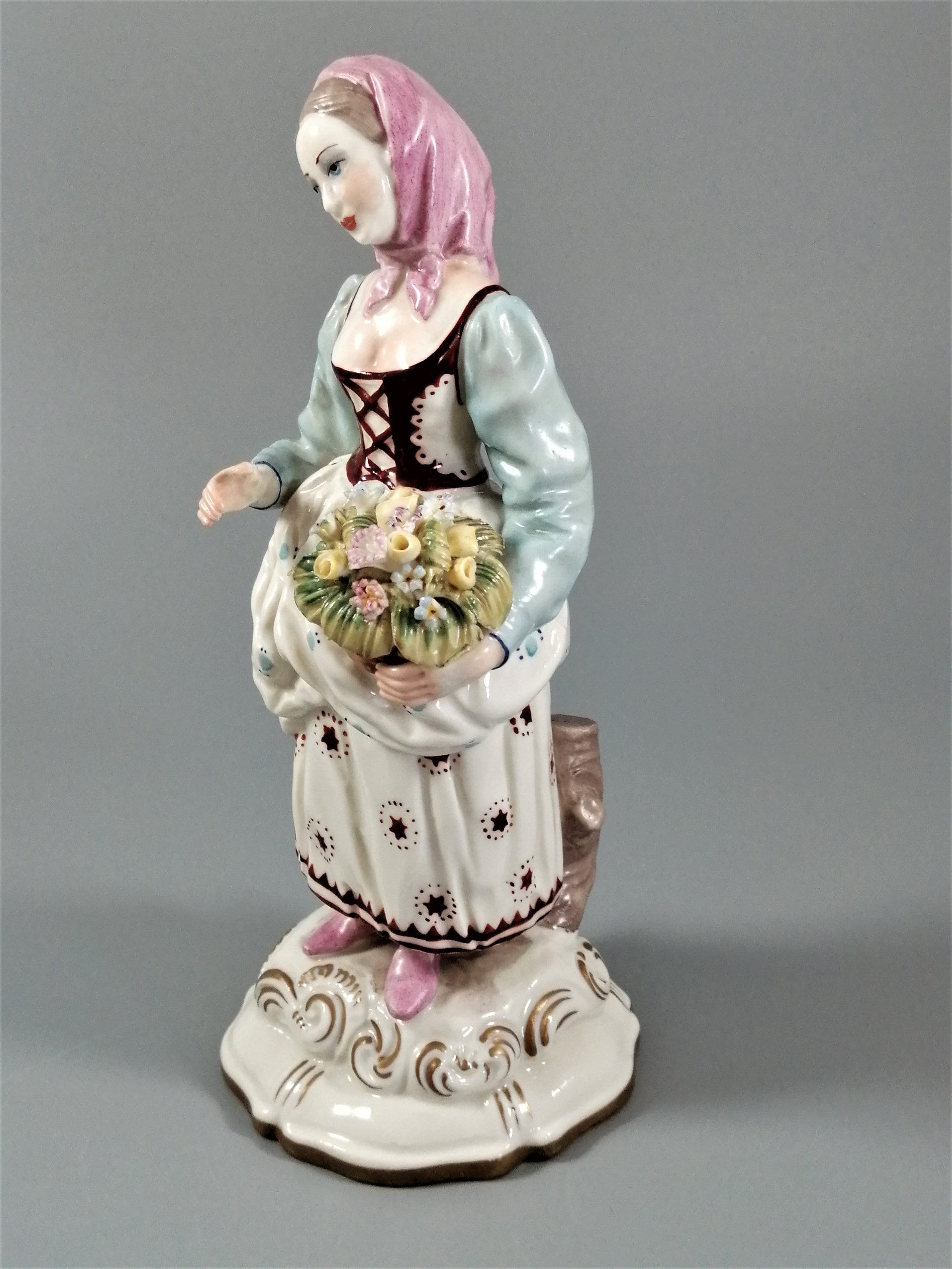 Antique porcelain figurine marked with the crossed swords of Meissen