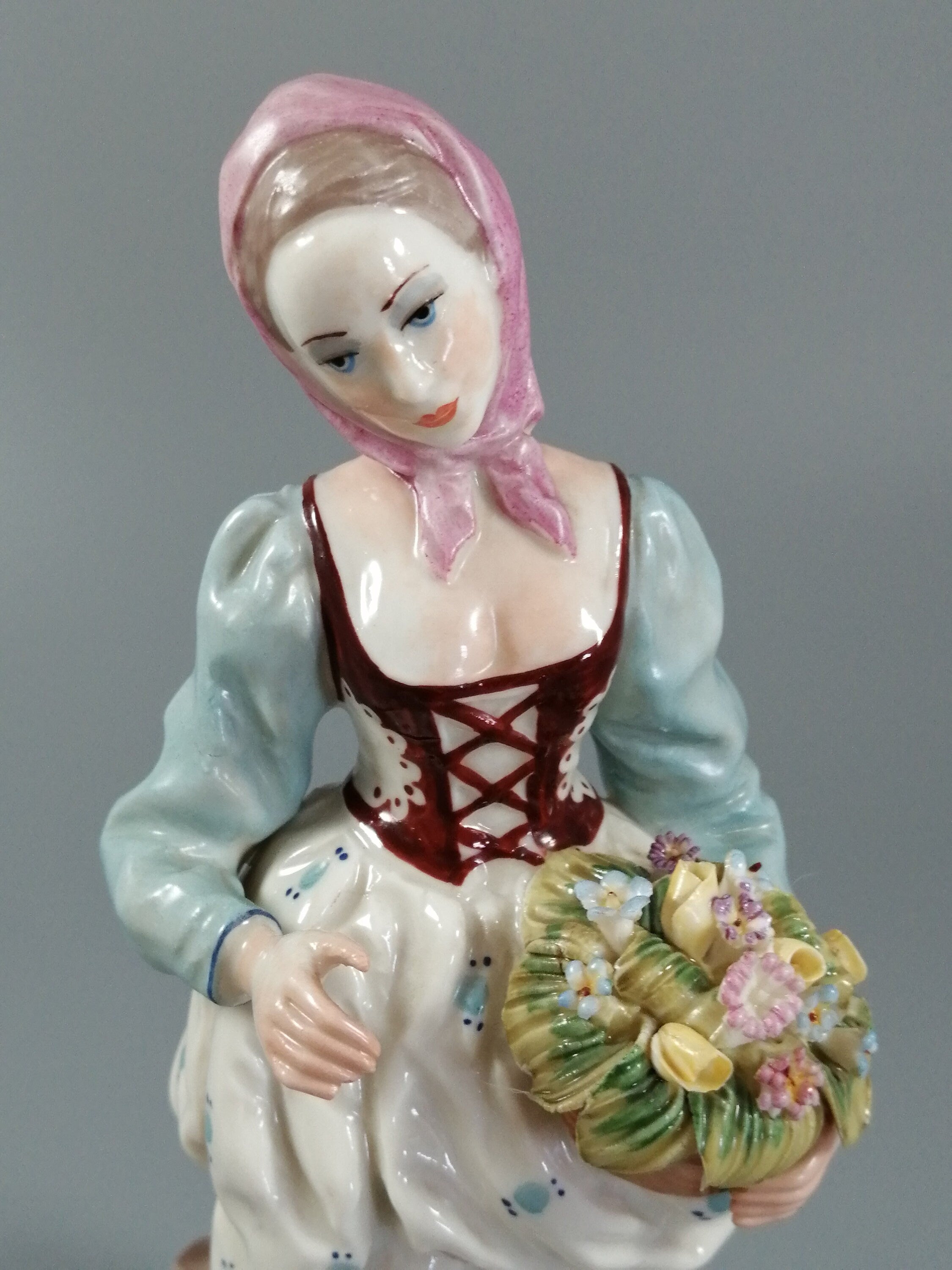 Antique porcelain figurine marked with the crossed swords of Meissen