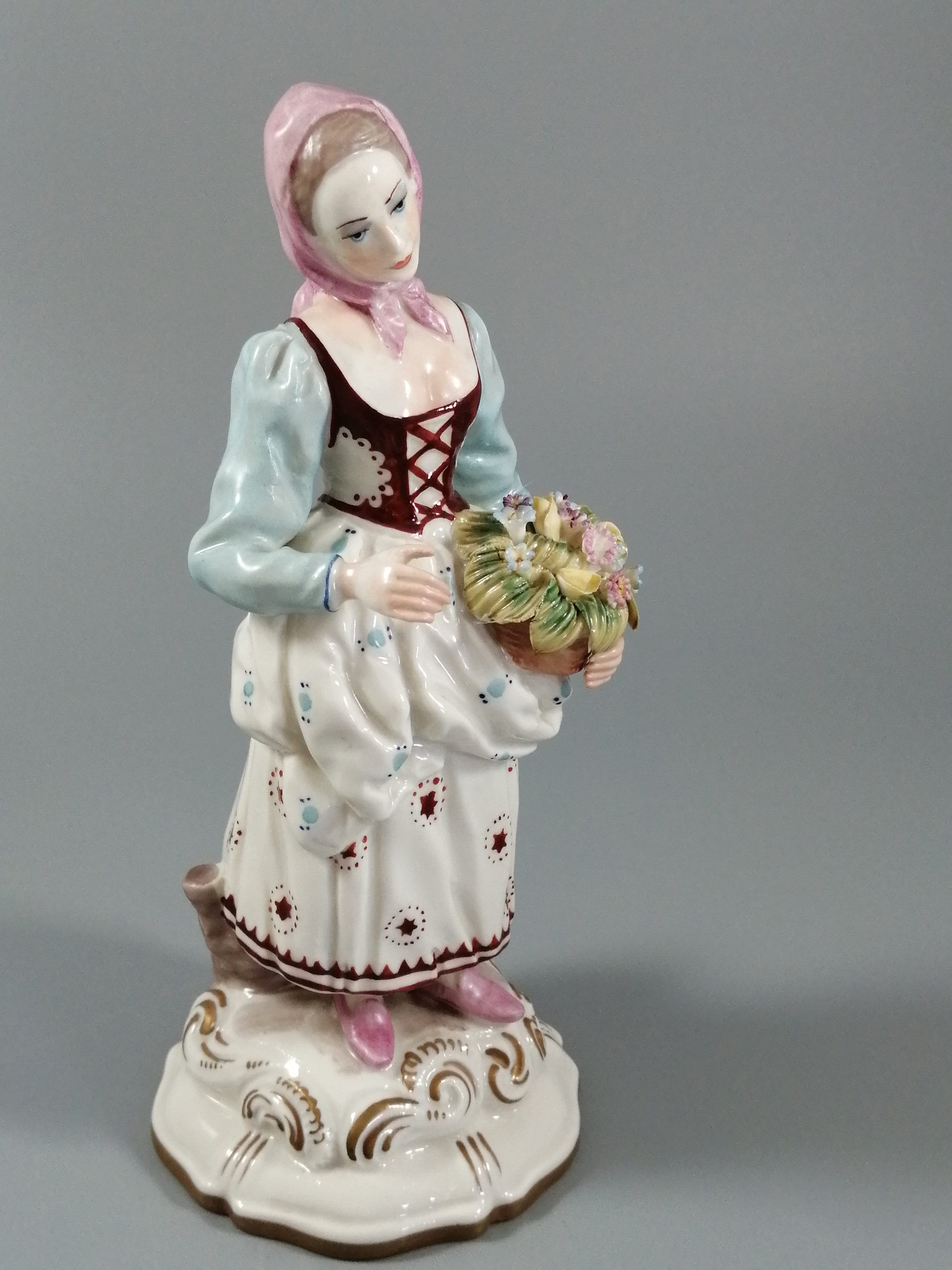 Antique porcelain figurine marked with the crossed swords of Meissen