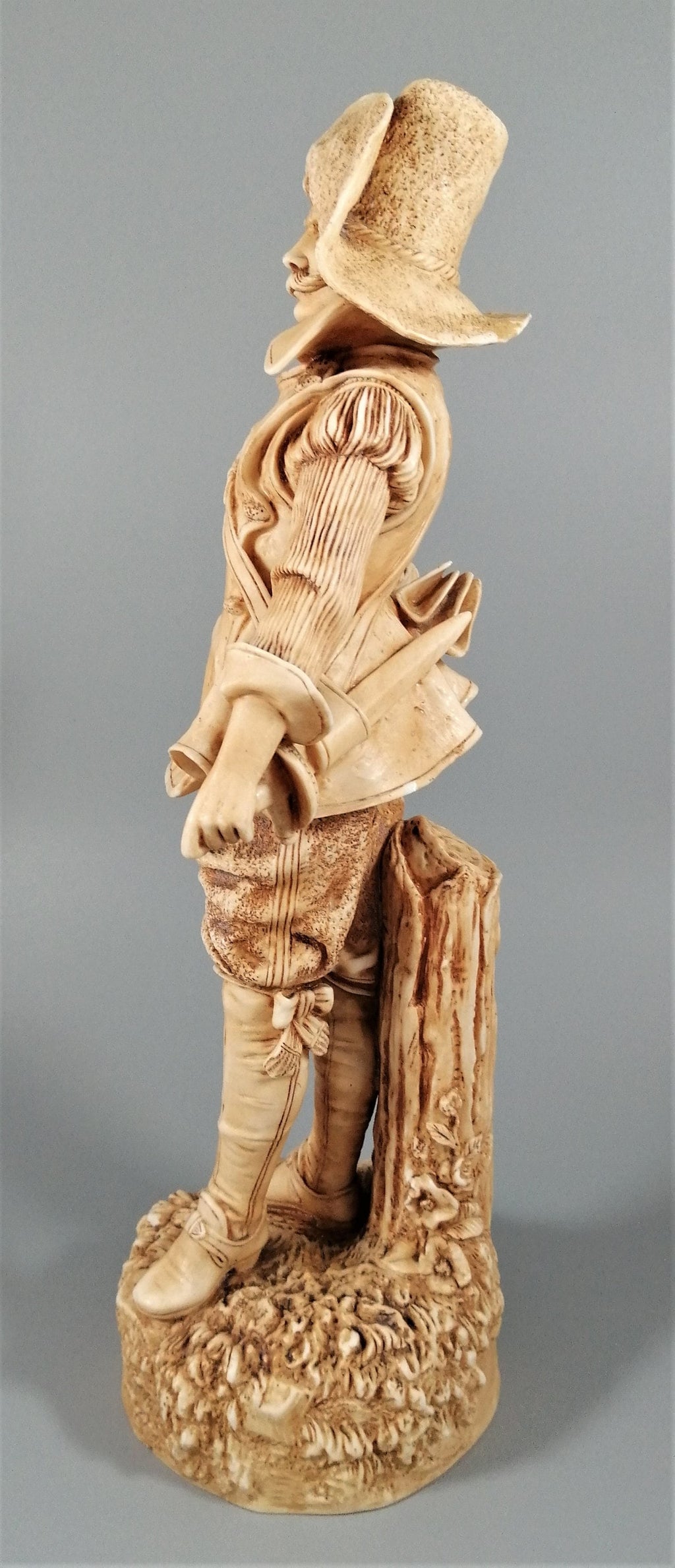 A Robinson and Leadbeater ivory parian ware figure of a musketeer