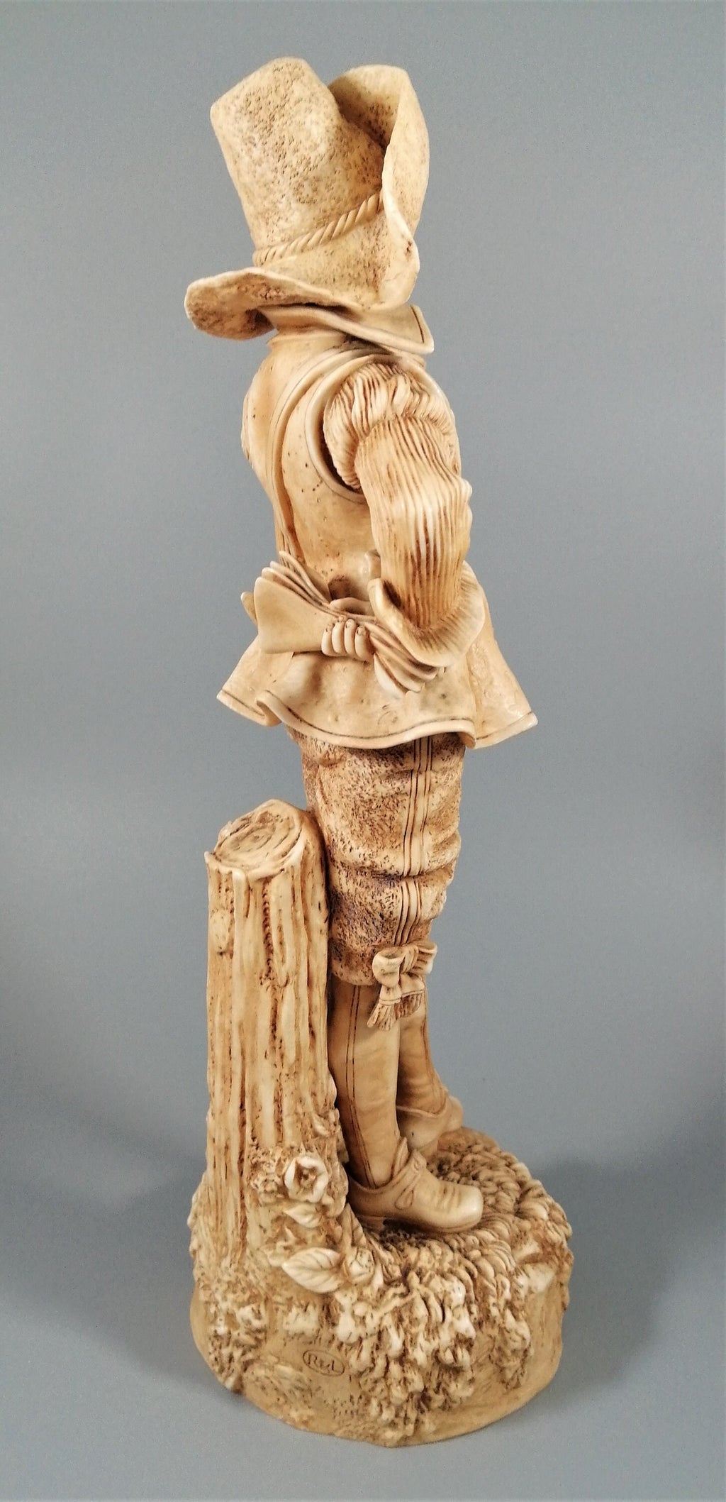 A Robinson and Leadbeater ivory parian ware figure of a musketeer
