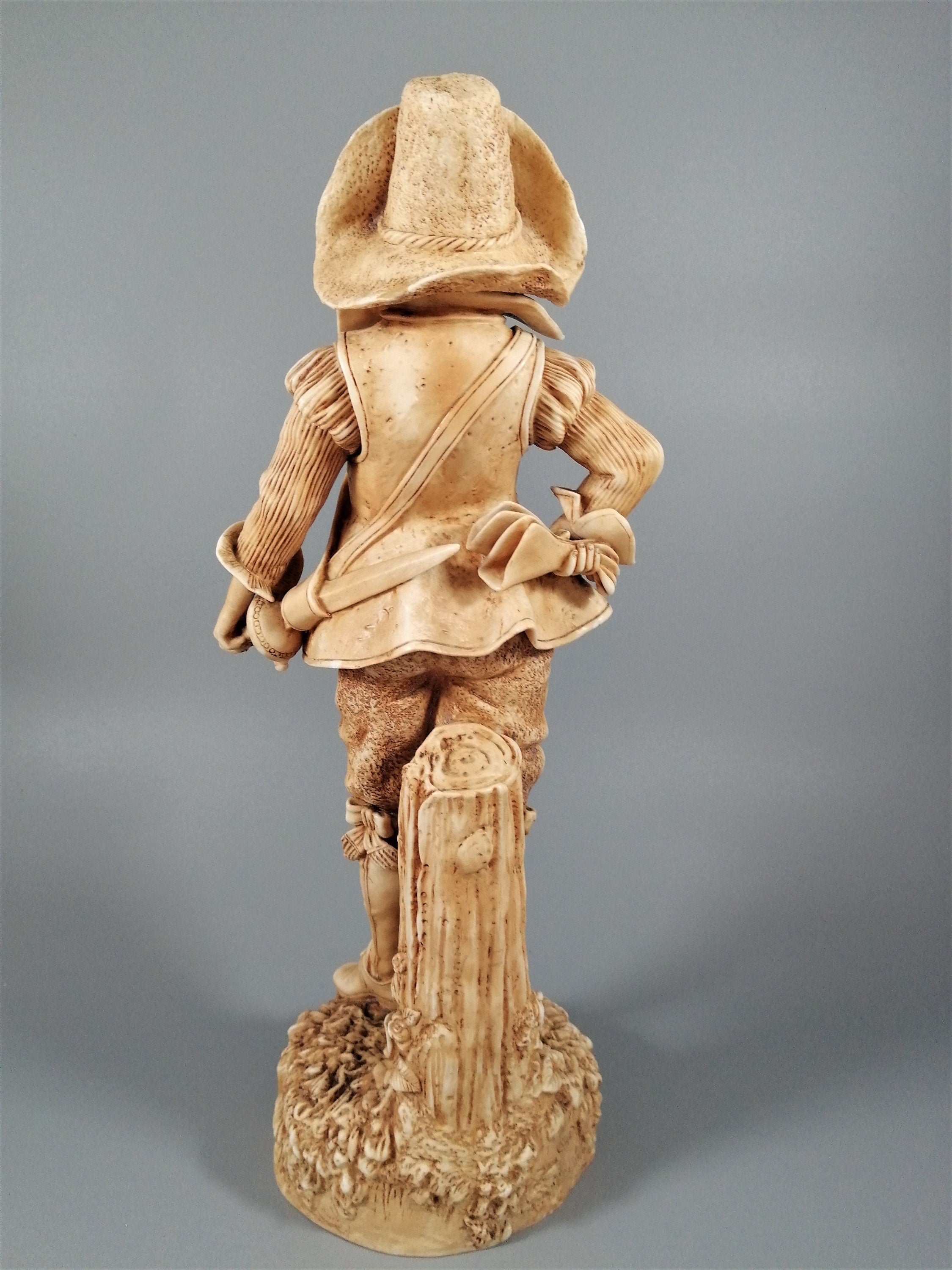 A Robinson and Leadbeater ivory parian ware figure of a musketeer