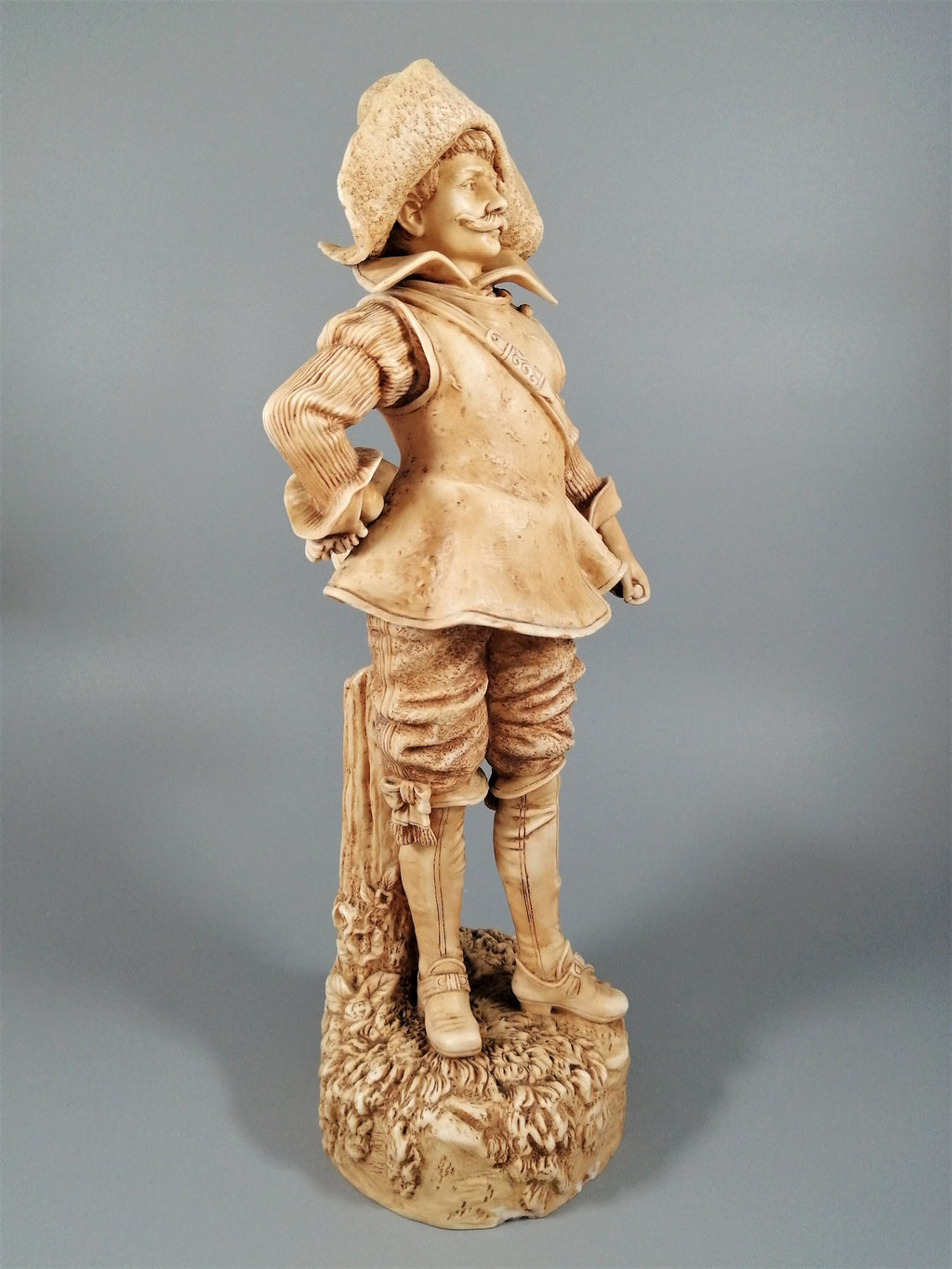 A Robinson and Leadbeater ivory parian ware figure of a musketeer