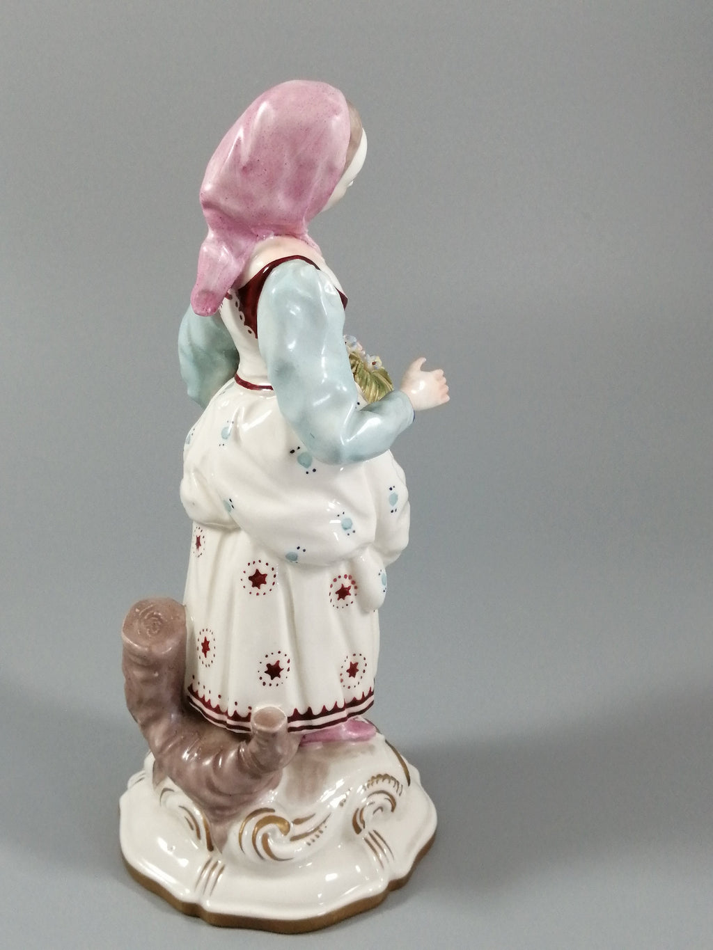 Antique porcelain figurine marked with the crossed swords of Meissen
