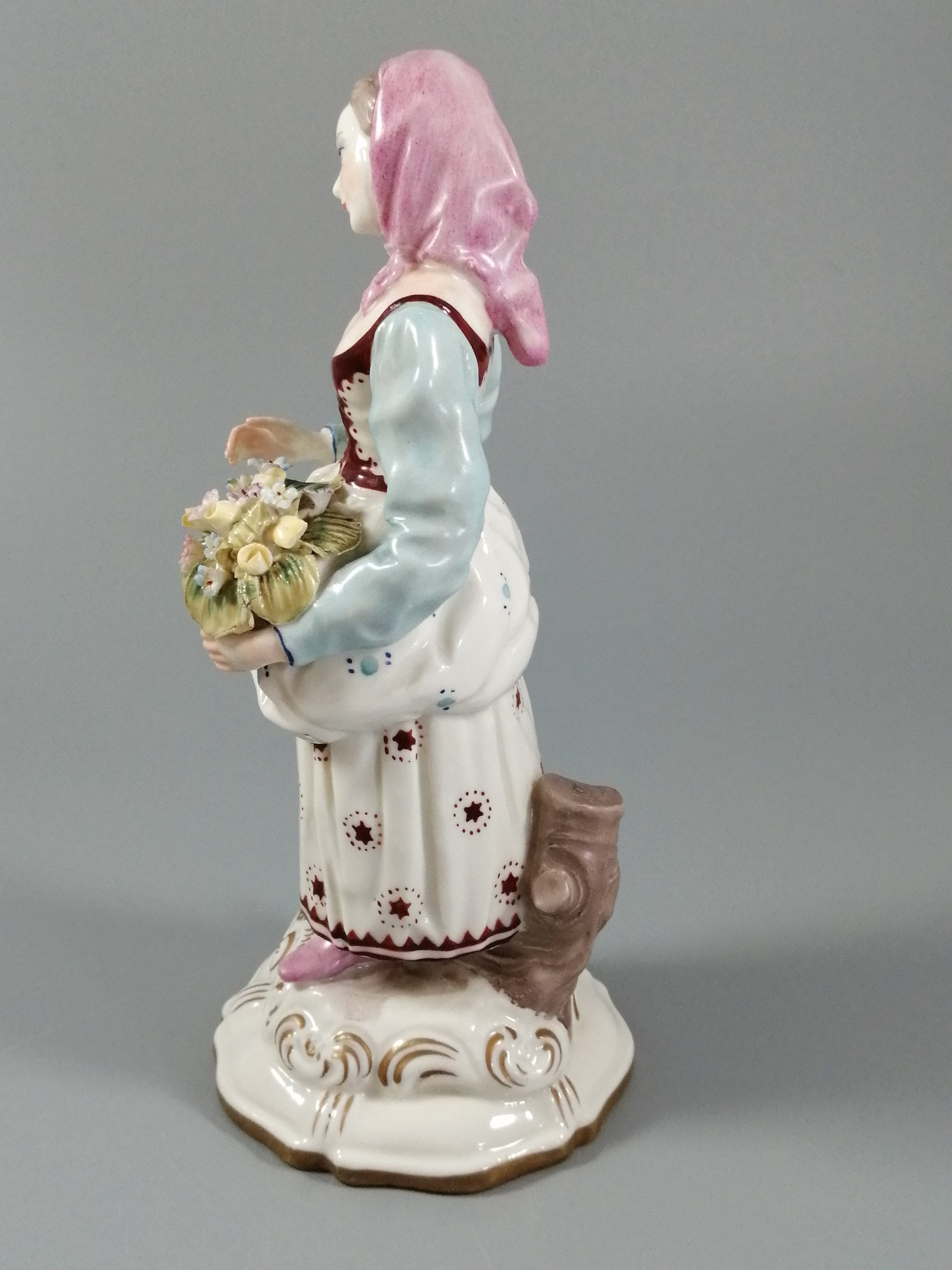 Antique porcelain figurine marked with the crossed swords of Meissen