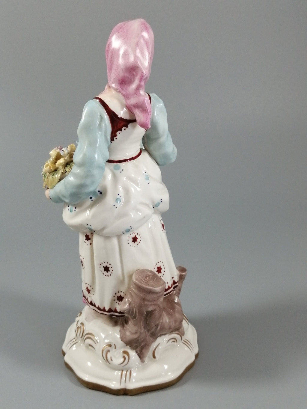 Antique porcelain figurine marked with the crossed swords of Meissen