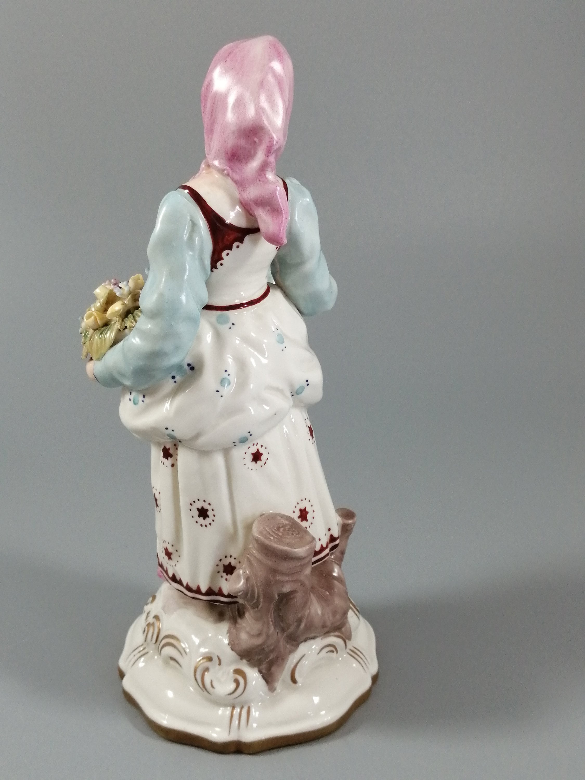 Antique porcelain figurine marked with the crossed swords of Meissen