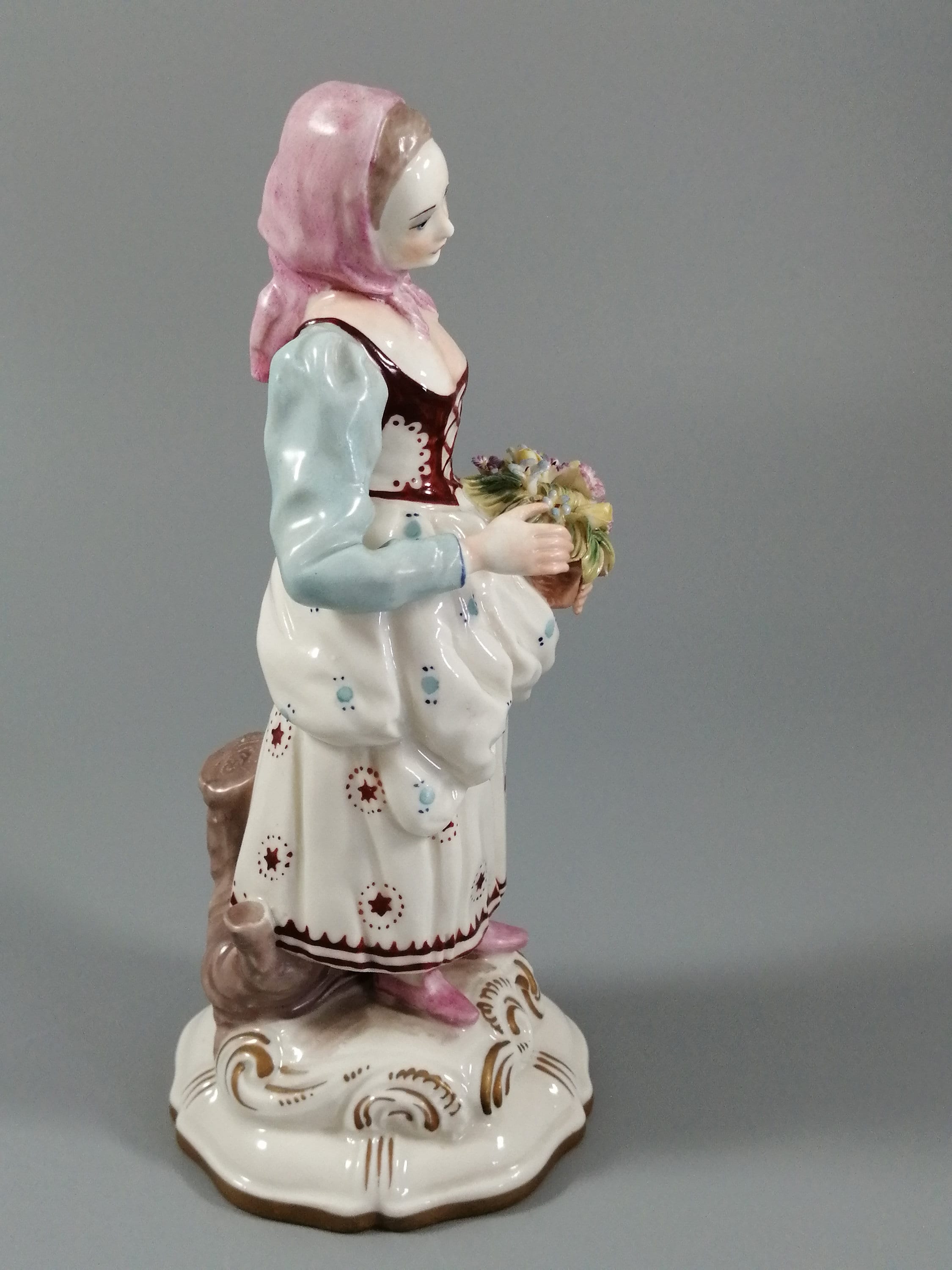 Antique porcelain figurine marked with the crossed swords of Meissen