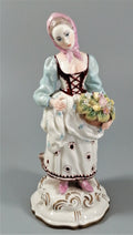 Antique porcelain figurine marked with the crossed swords of Meissen