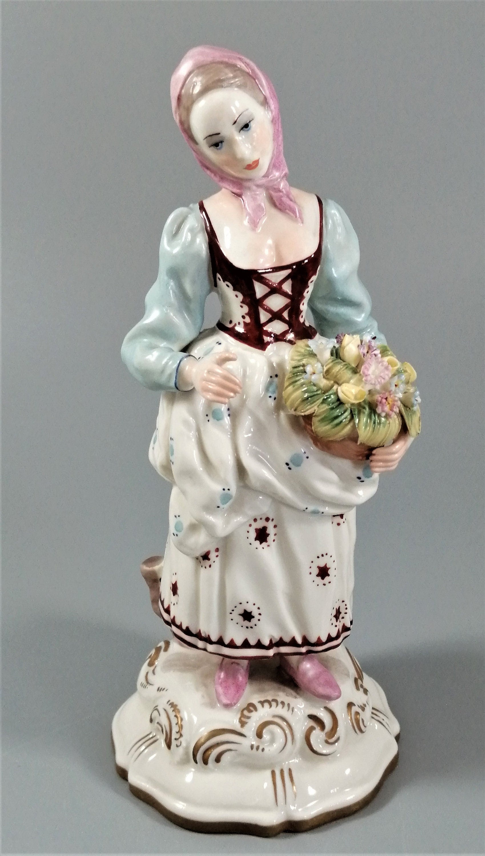 Antique porcelain figurine marked with the crossed swords of Meissen