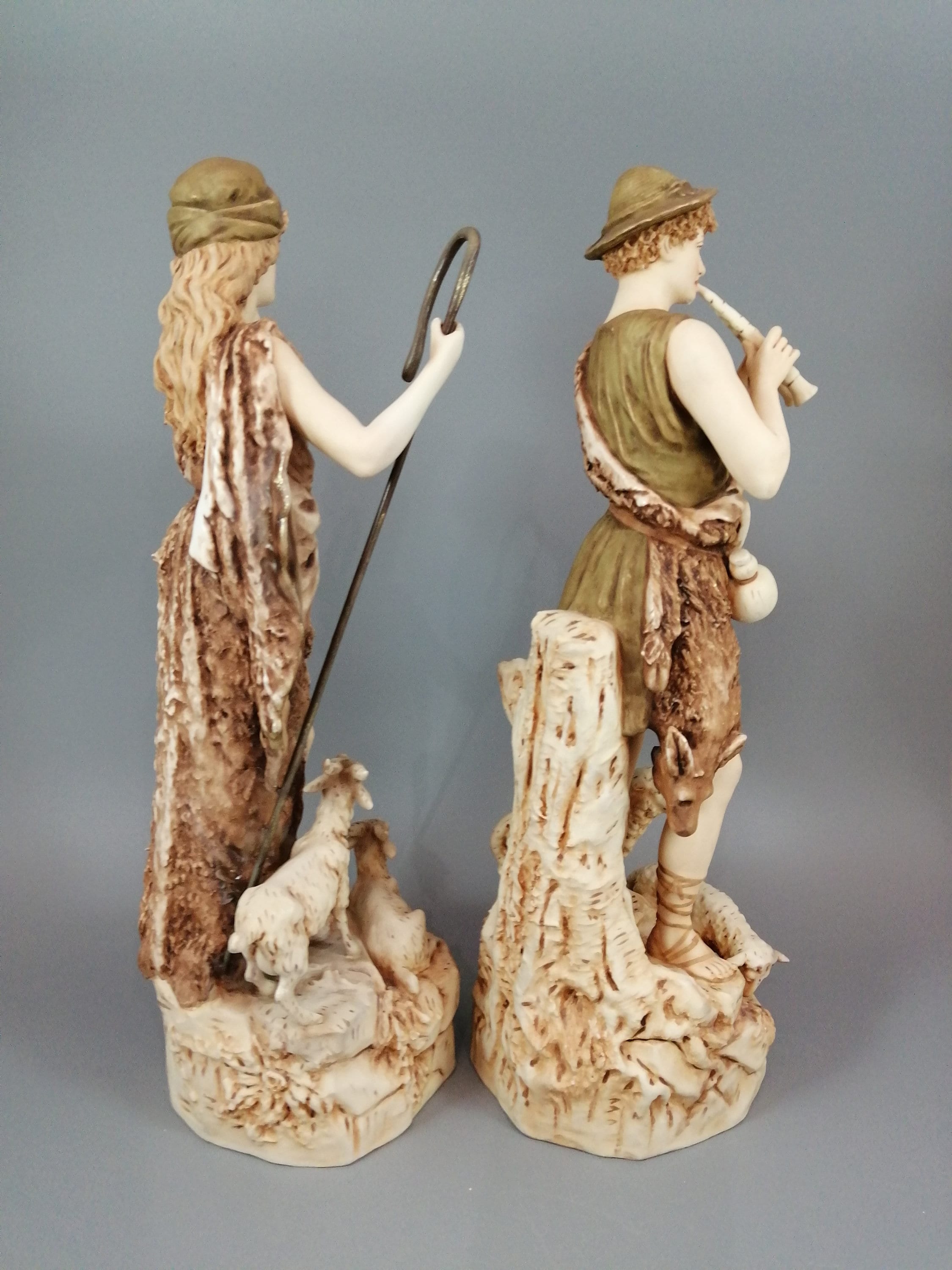 A pair of shepherd and shepherdess statuettes made of Royal Dux porcelain