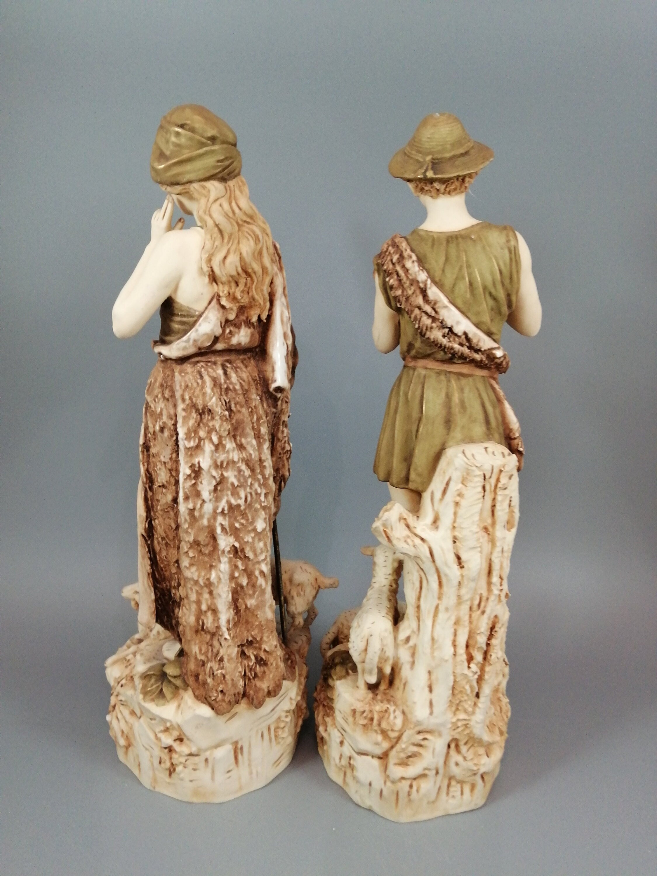 A pair of shepherd and shepherdess statuettes made of Royal Dux porcelain