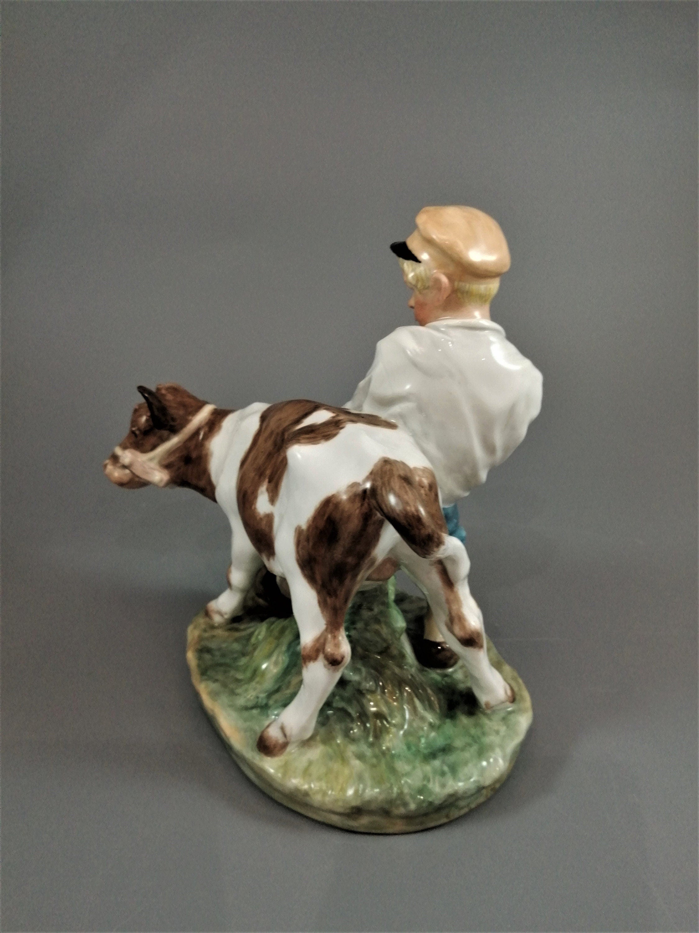 Royal Copenhagen Porcelain Figurine: Boy with Calf, Juliane Marie Design