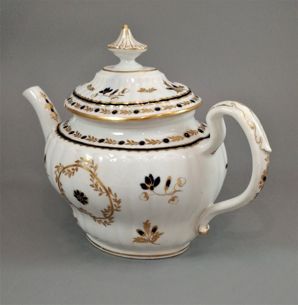 Flight & Barr Worcester barrel-shaped teapot and stand, gold and blue floral design, incised 'M' mark, antique English porcelain, c. 1792