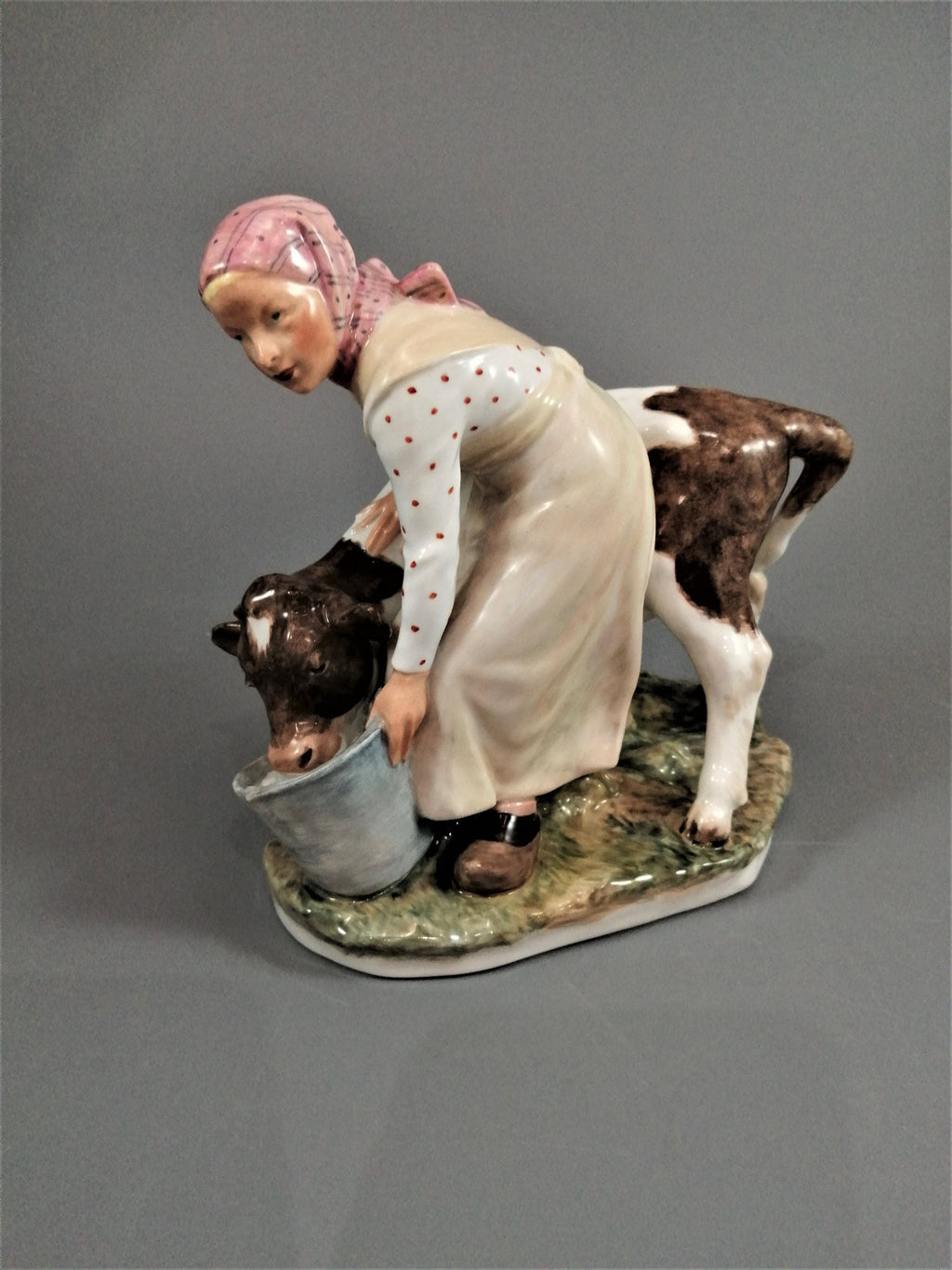 Royal Copenhagen Porcelain Figurine: Girl with Calf, Juliane Marie Polychrome