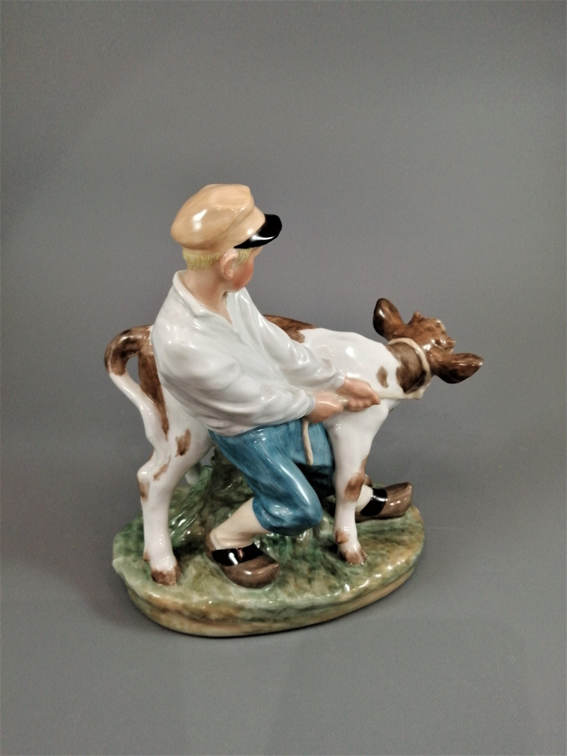 Royal Copenhagen Porcelain Figurine: Boy with Calf, Juliane Marie Design