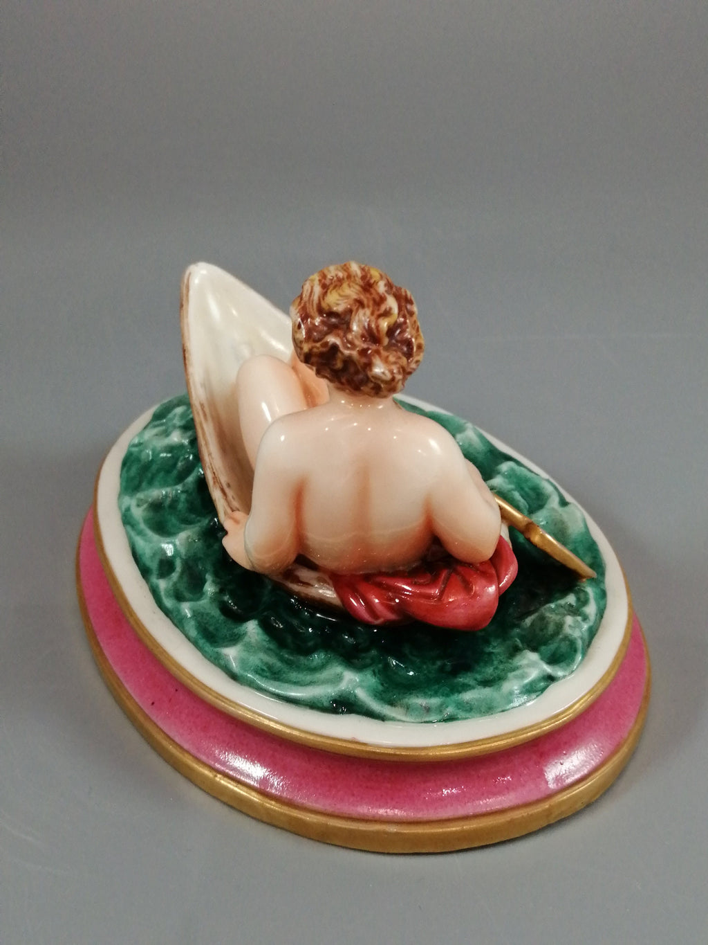 Antique majolica pottery figurine, nude girl in a boat, rare pink-base figure, Minton or French style, gilded oar, 12.8 cm