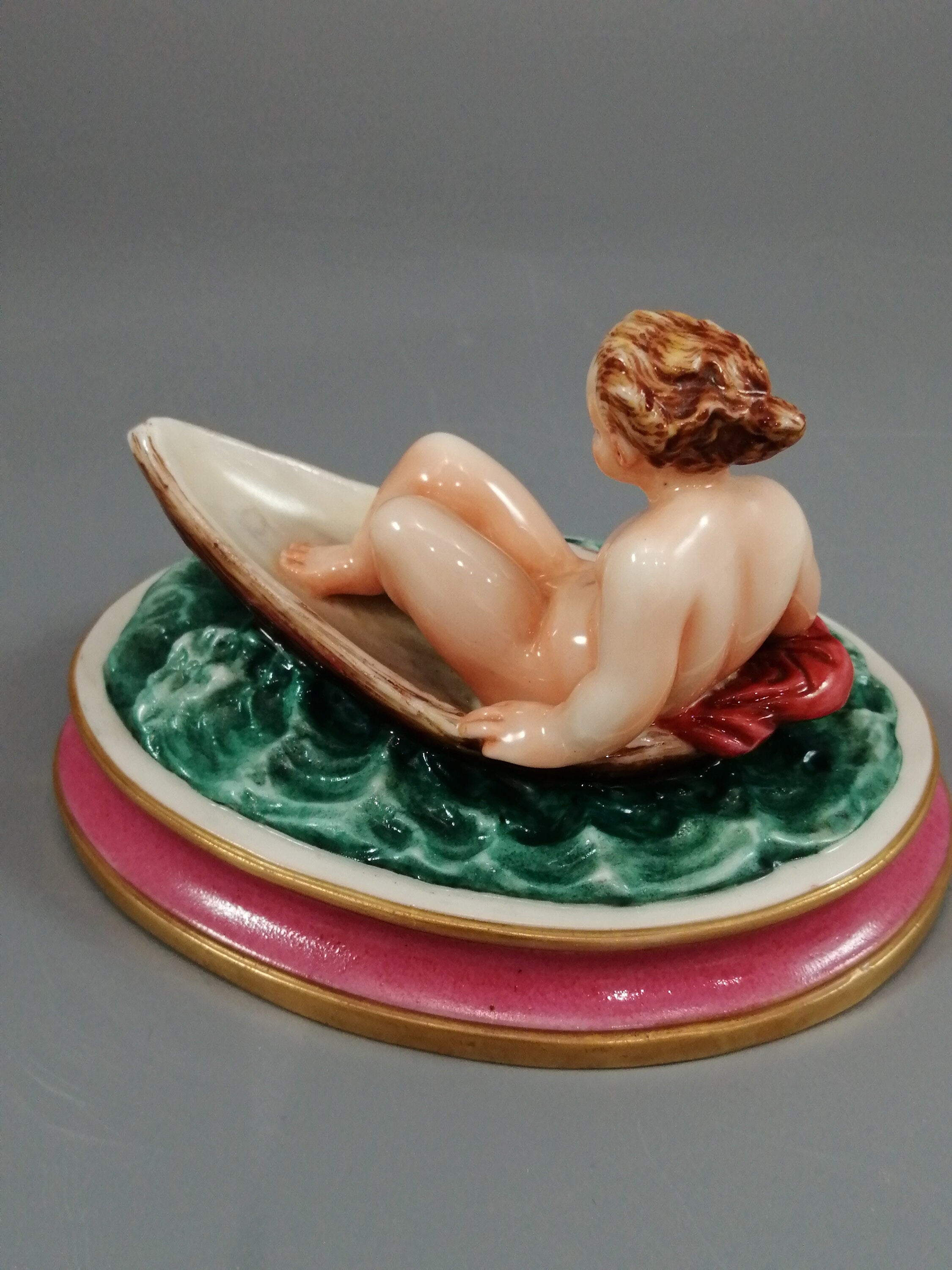 Antique majolica pottery figurine, nude girl in a boat, rare pink-base figure, Minton or French style, gilded oar, 12.8 cm