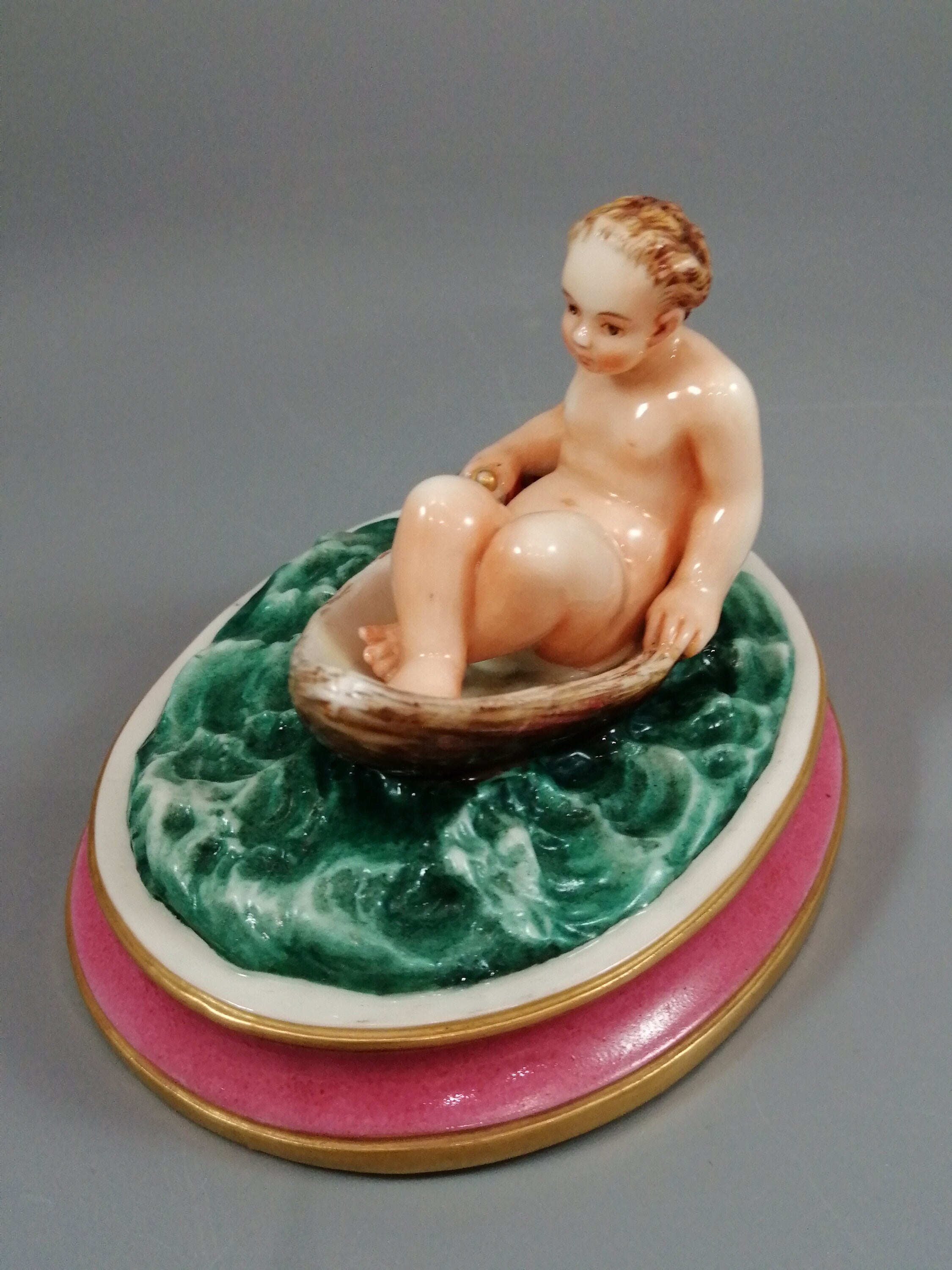 Antique majolica pottery figurine, nude girl in a boat, rare pink-base figure, Minton or French style, gilded oar, 12.8 cm