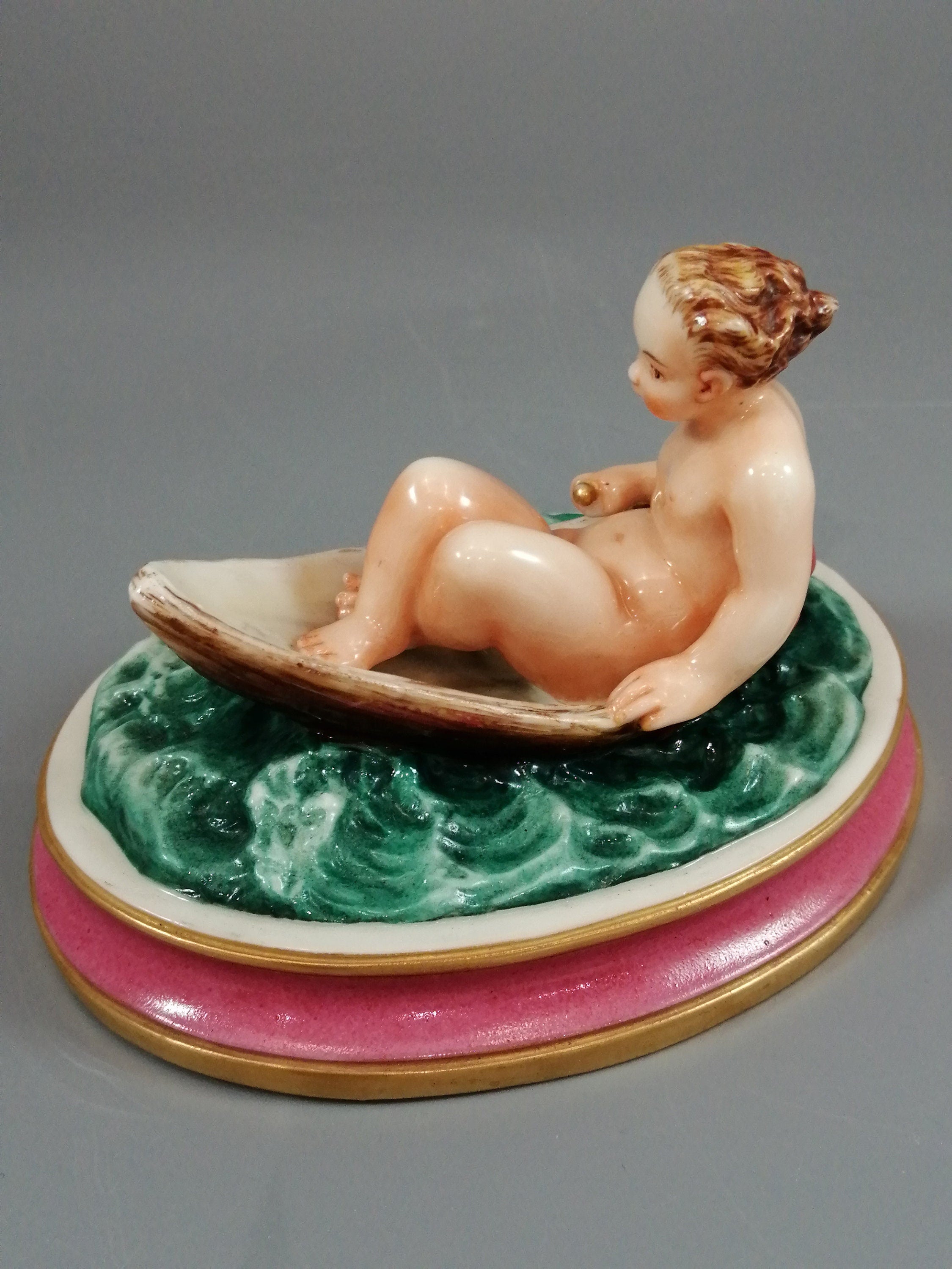 Antique majolica pottery figurine, nude girl in a boat, rare pink-base figure, Minton or French style, gilded oar, 12.8 cm