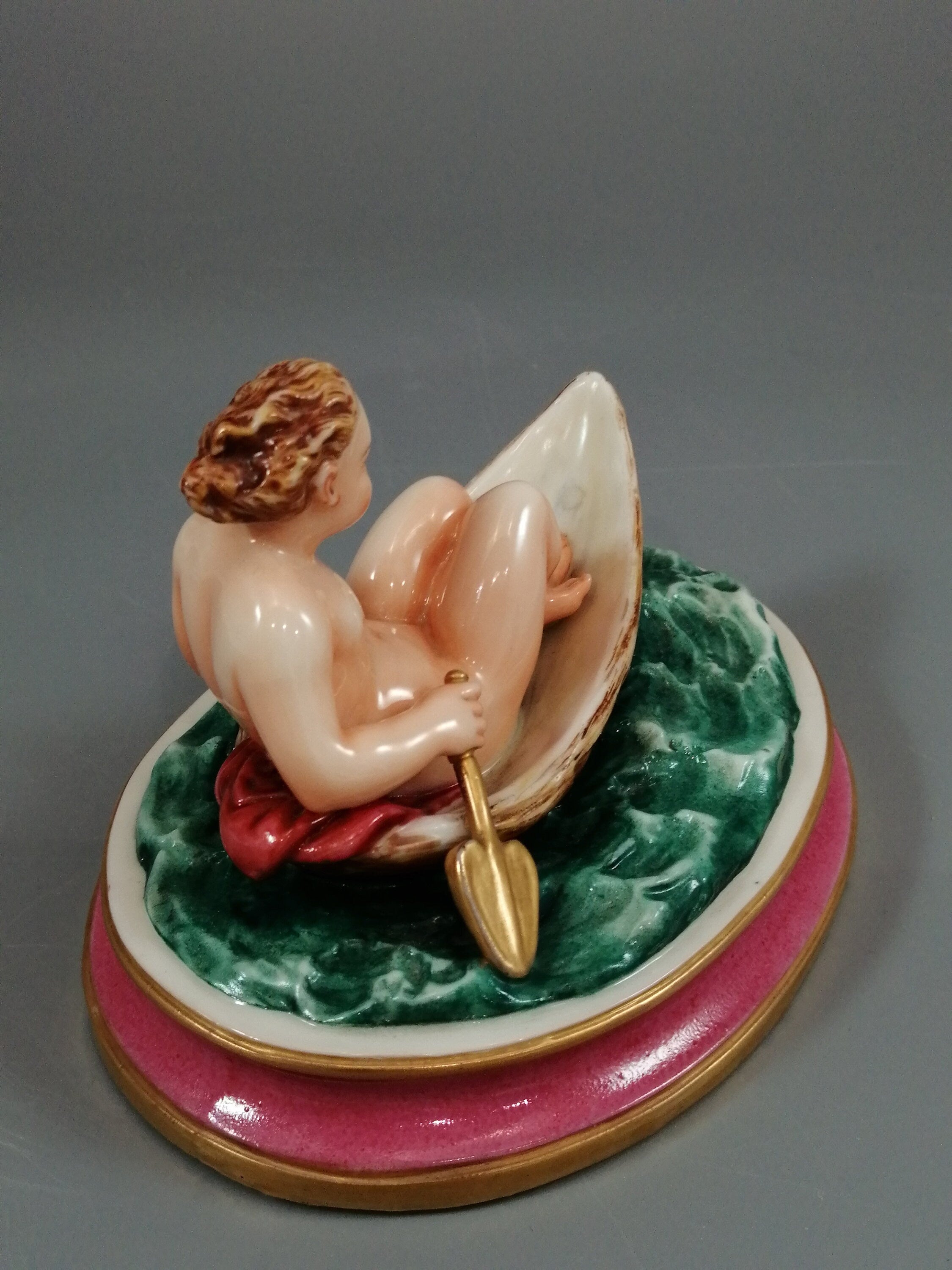 Antique majolica pottery figurine, nude girl in a boat, rare pink-base figure, Minton or French style, gilded oar, 12.8 cm